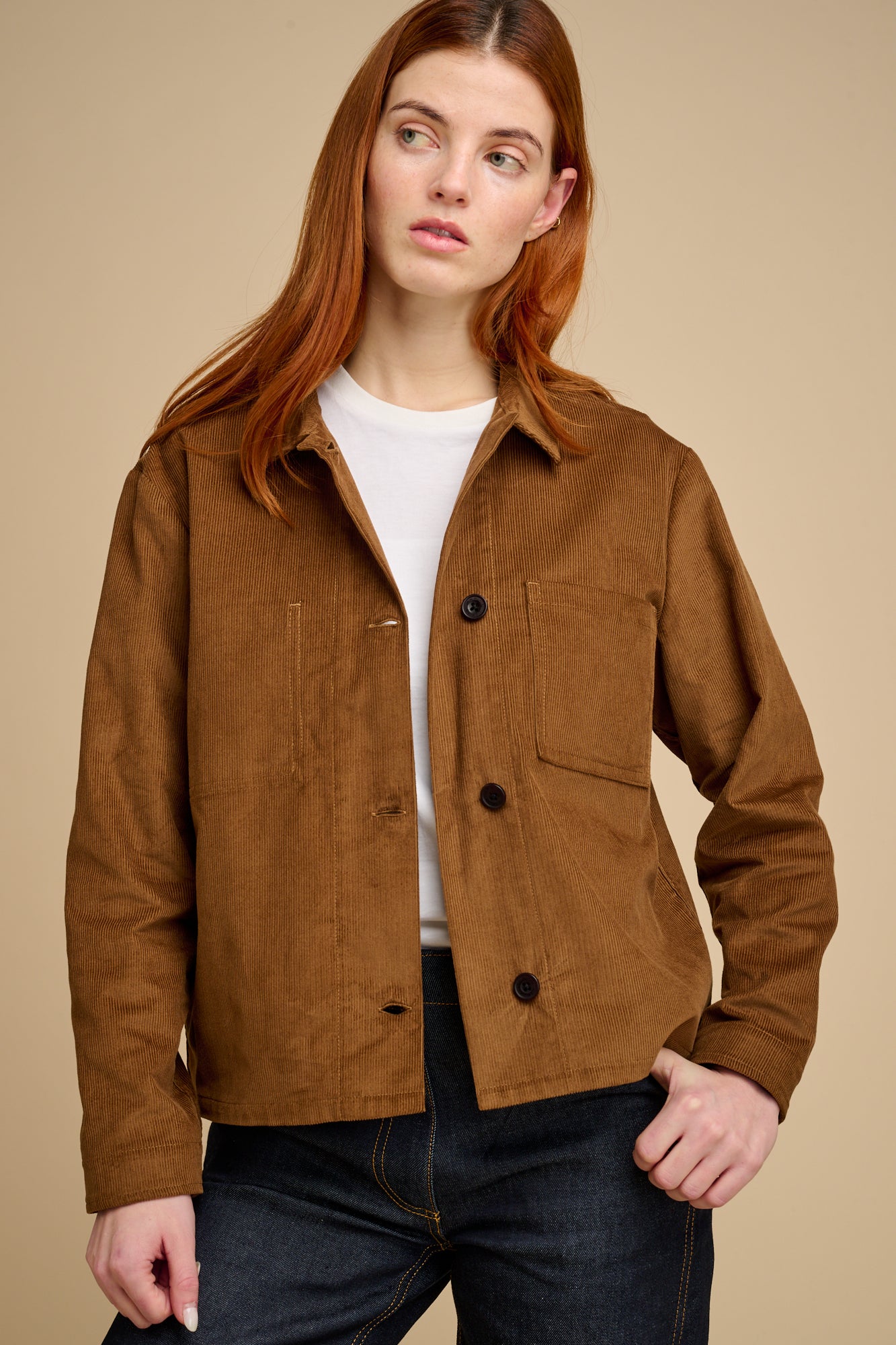 woman wearing tan cord shirt over white t shirt