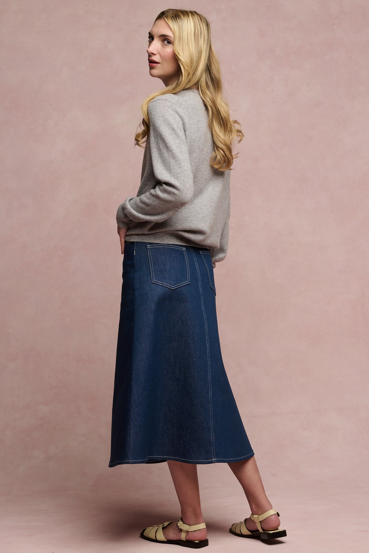 
            Full body image of the back of Bobbie a line midi skirt in blue with two back pockets