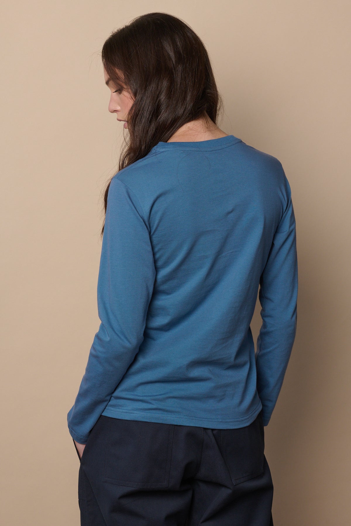 
            Thigh up image of the back of long sleeve t shirt in raf blue