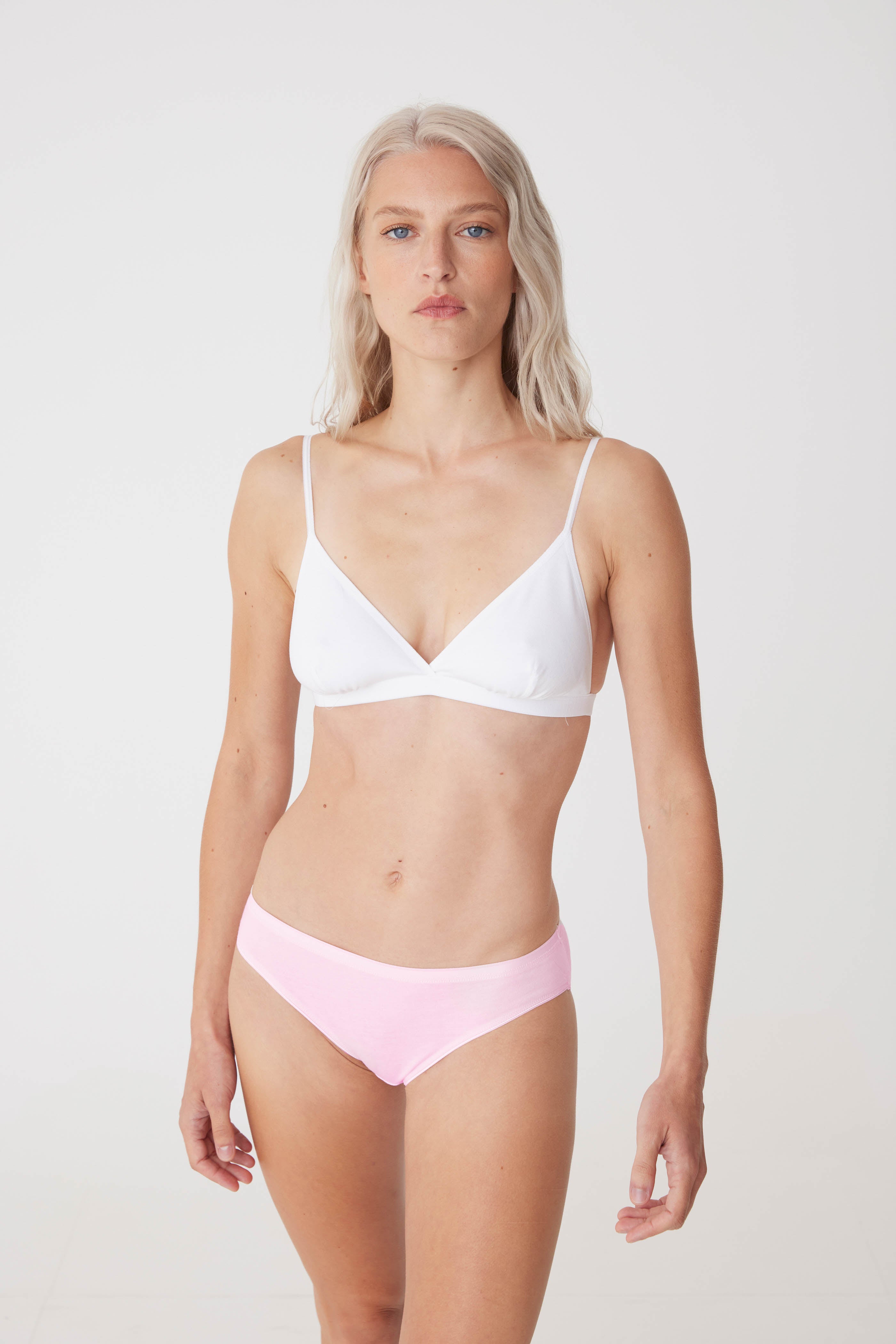white female wearing soft pink low rise brief