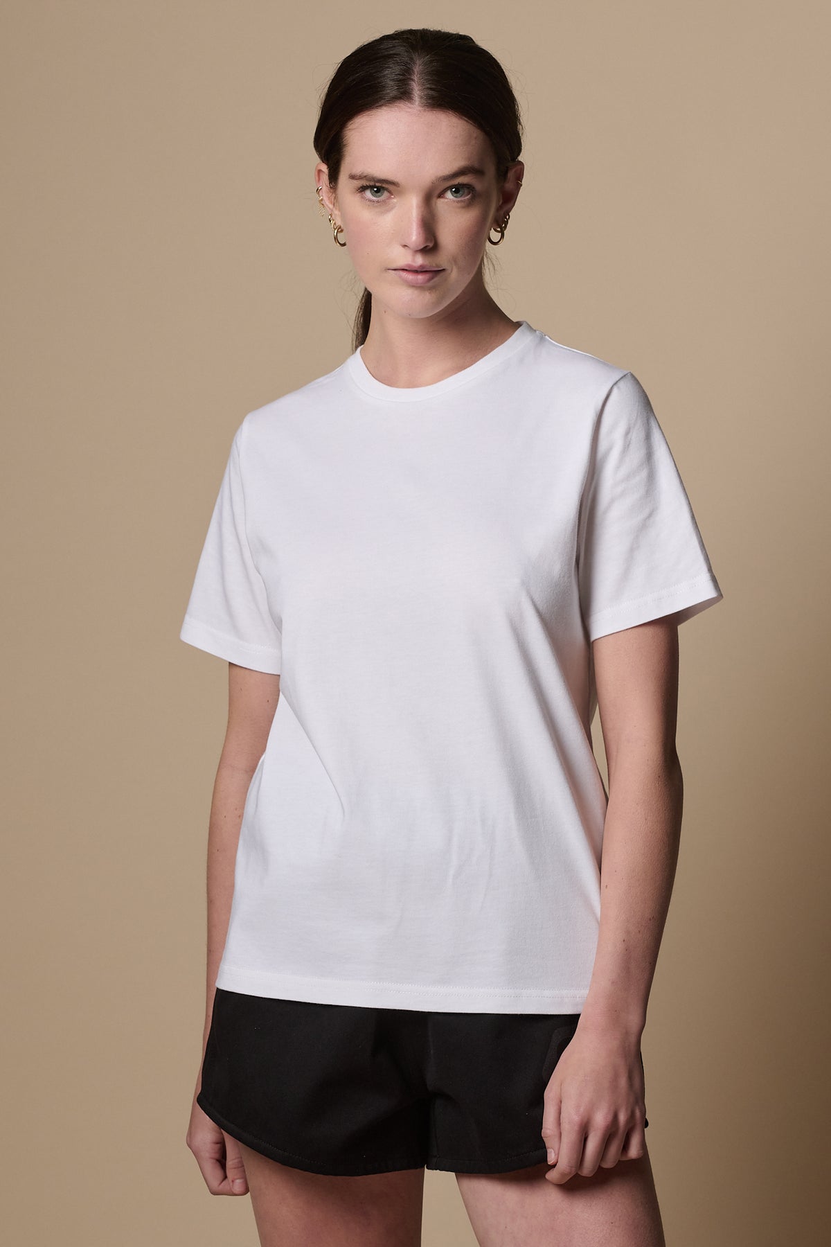 
            Thigh up image of women&#39;s short sleeve t shirt in white