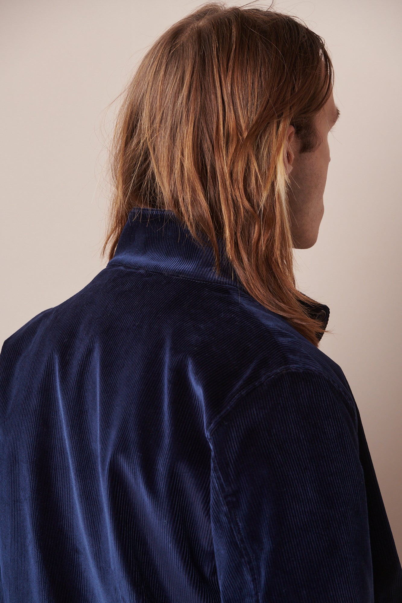Image of the back of corduroy Harrington in navy