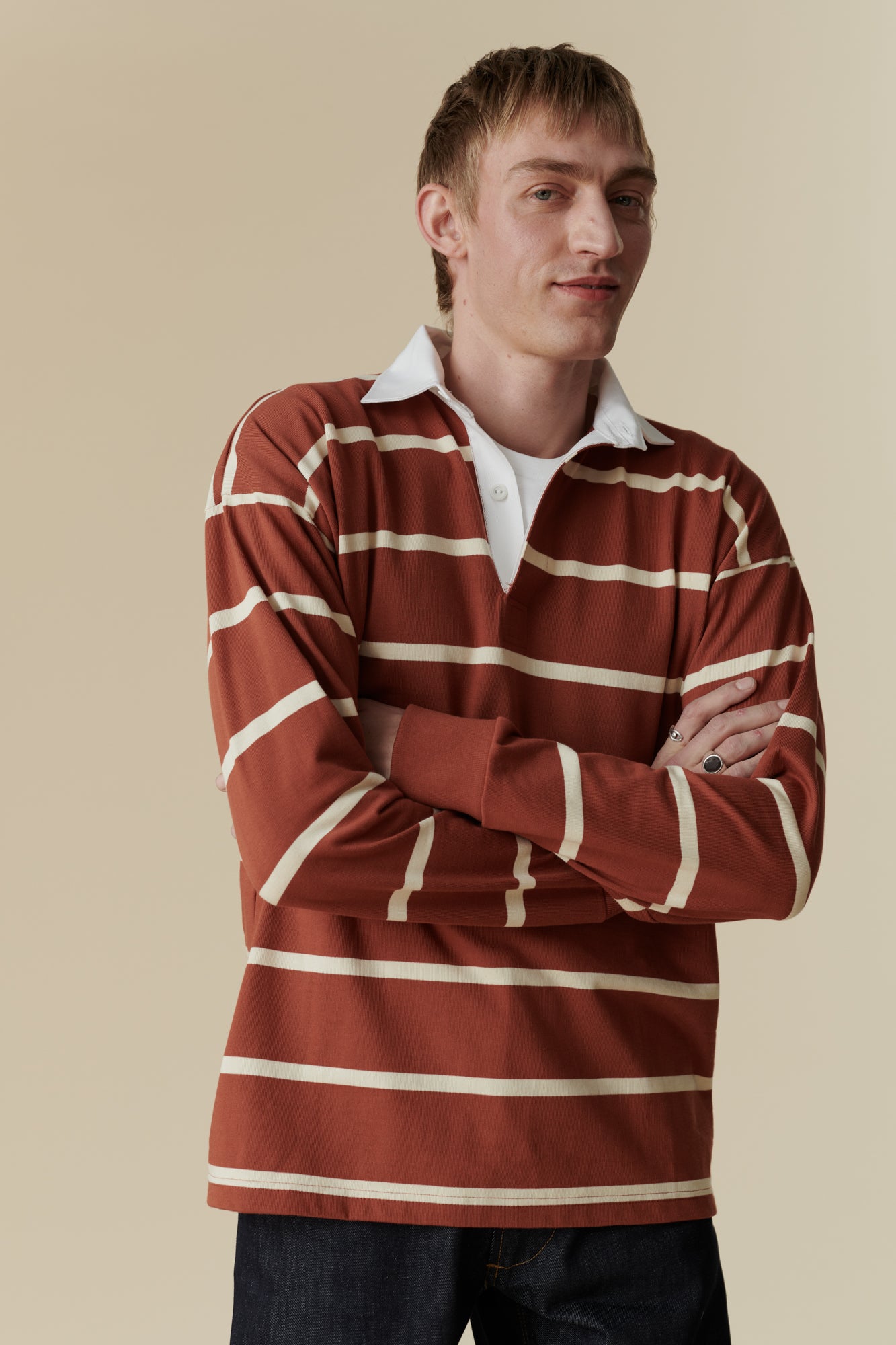 Male wearing rugby shirt in cinnamon and ecru