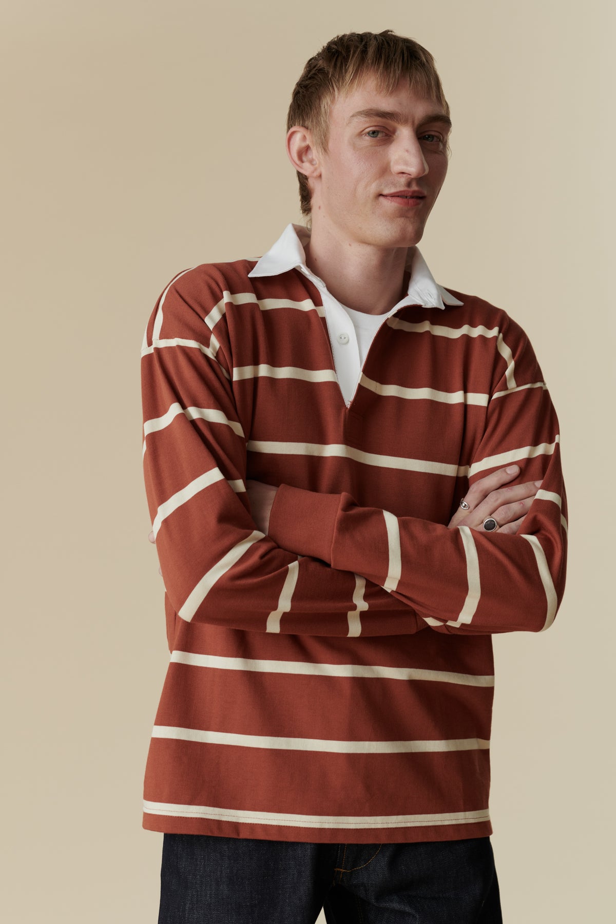 
            Male wearing rugby shirt in cinnamon and ecru