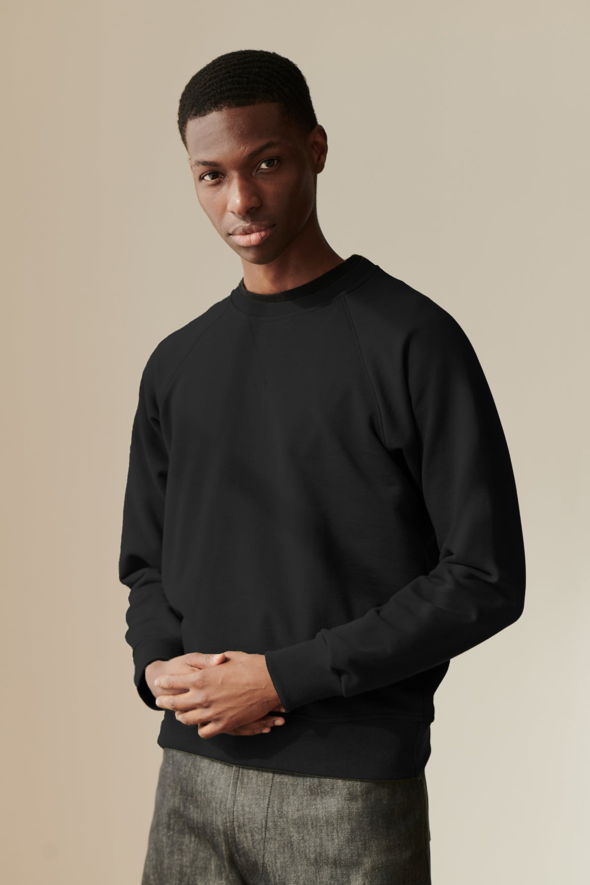 
            Male wearing raglan sweatshirt in Black
