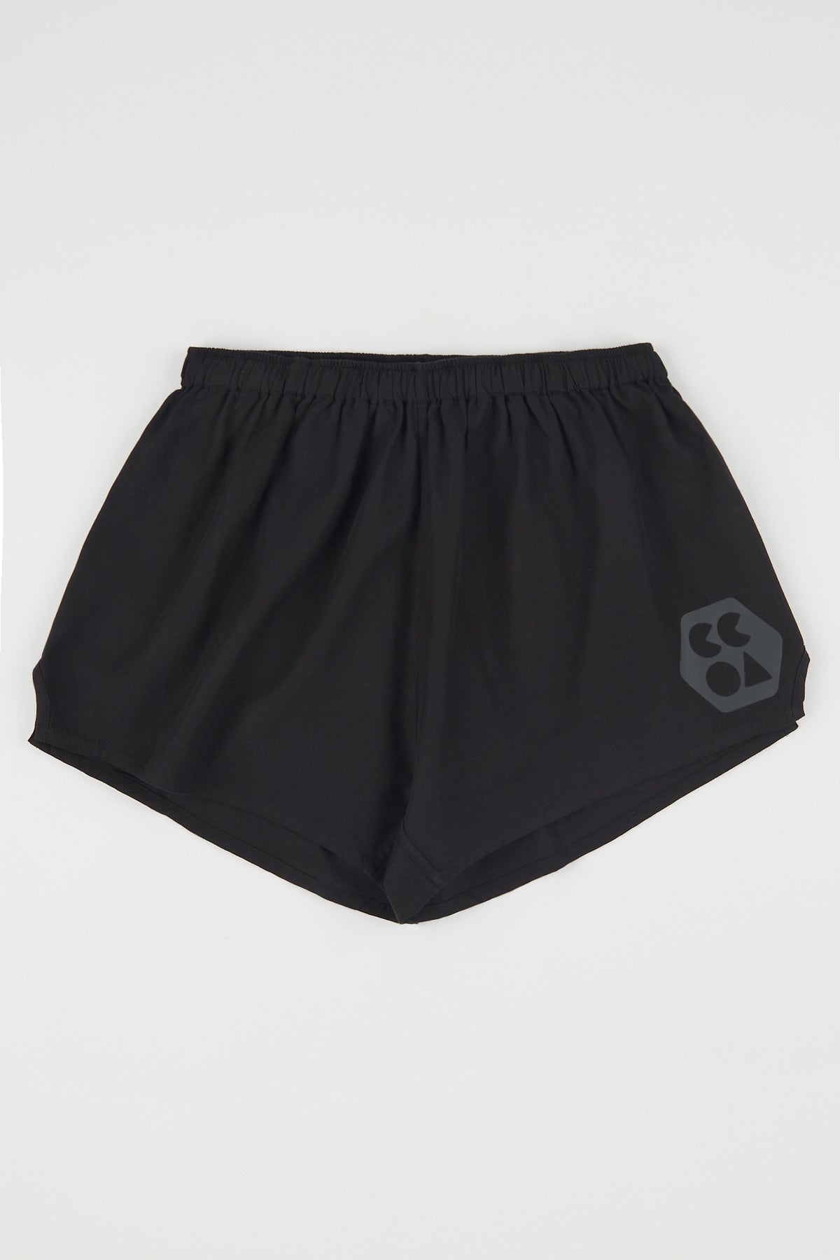 
            Flatlay product shot of women&#39;s lightweight sports short plastic free in black with CCOA logo