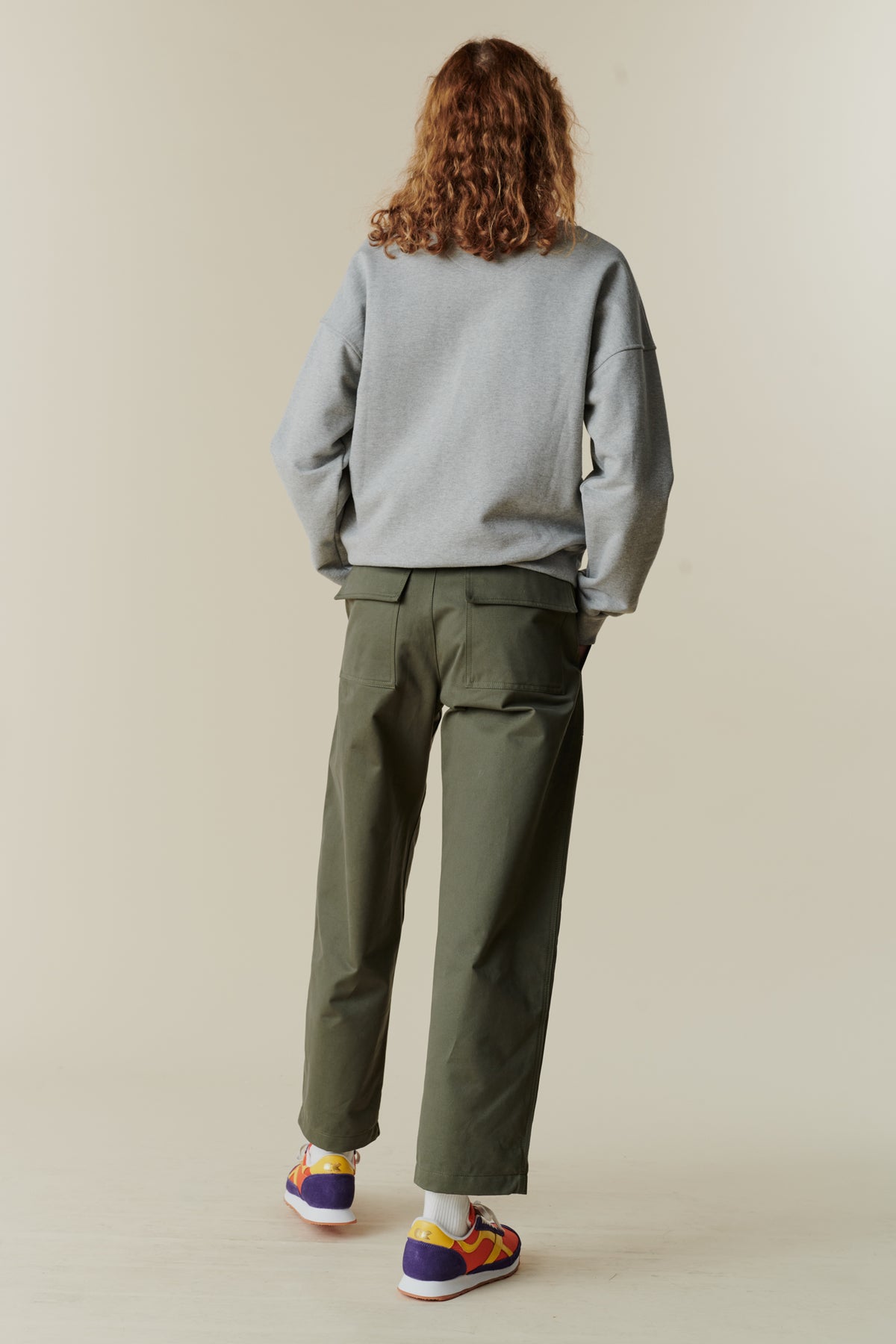 Full body back image of female in combat trouser olive