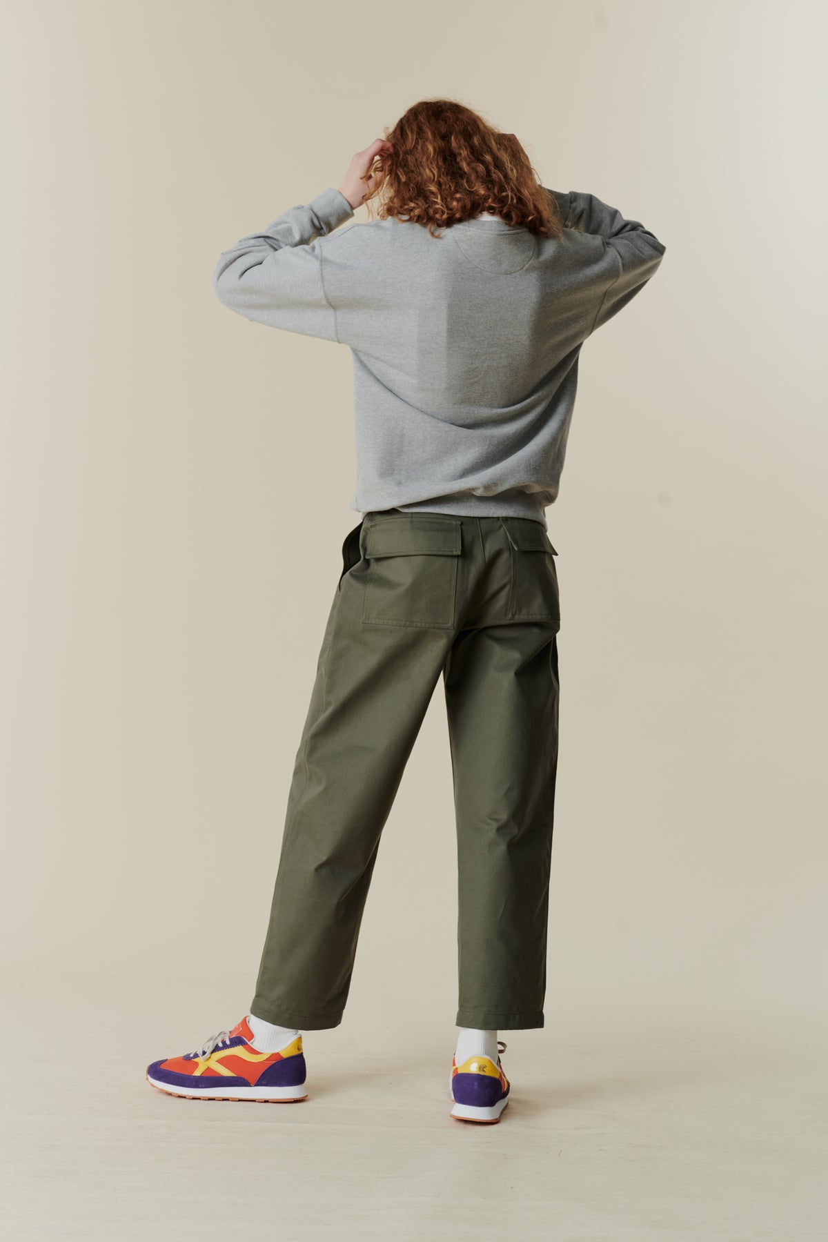 
            back of female wearing olive combat trouser