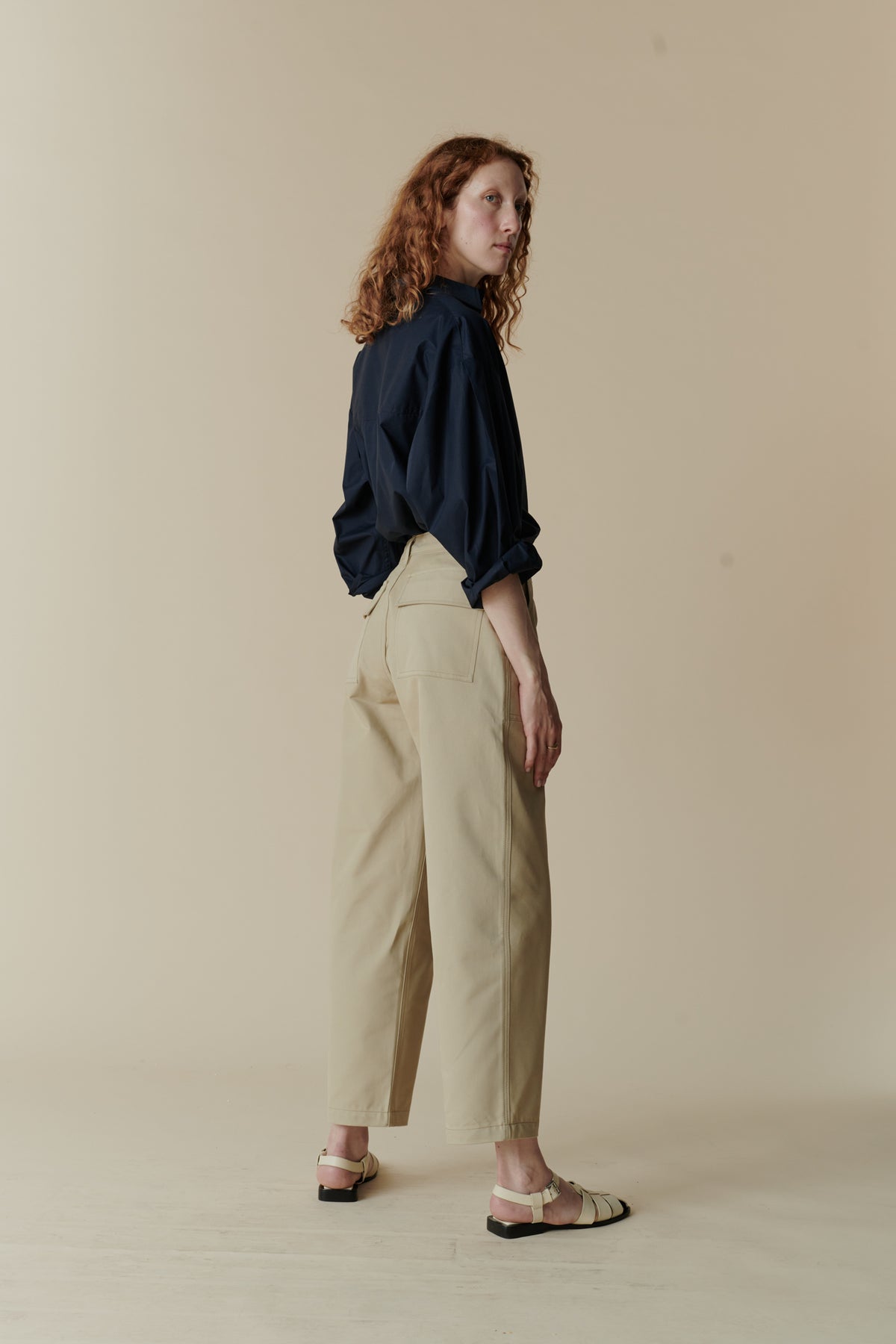 Full body image of back of combat trousers in putty