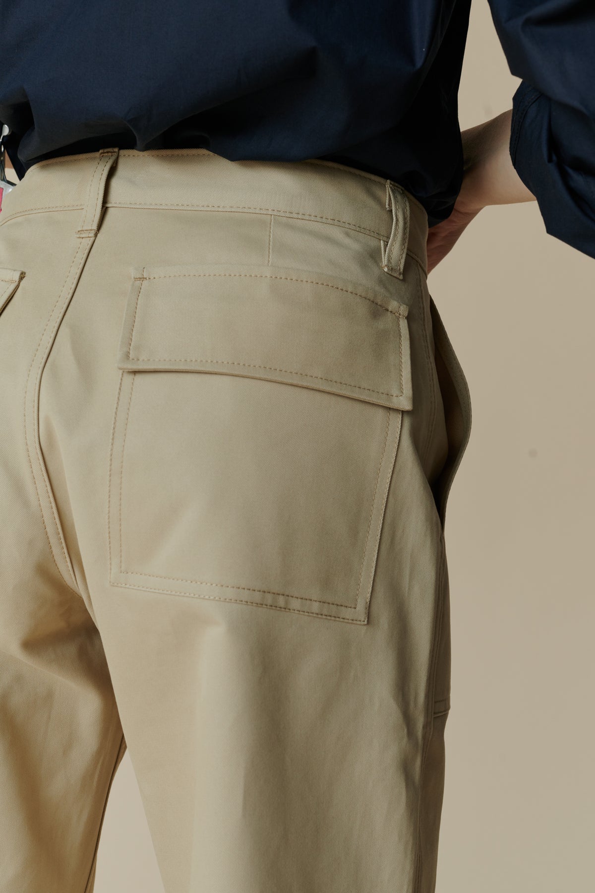 Back pocket detail image of combat trousers in putty