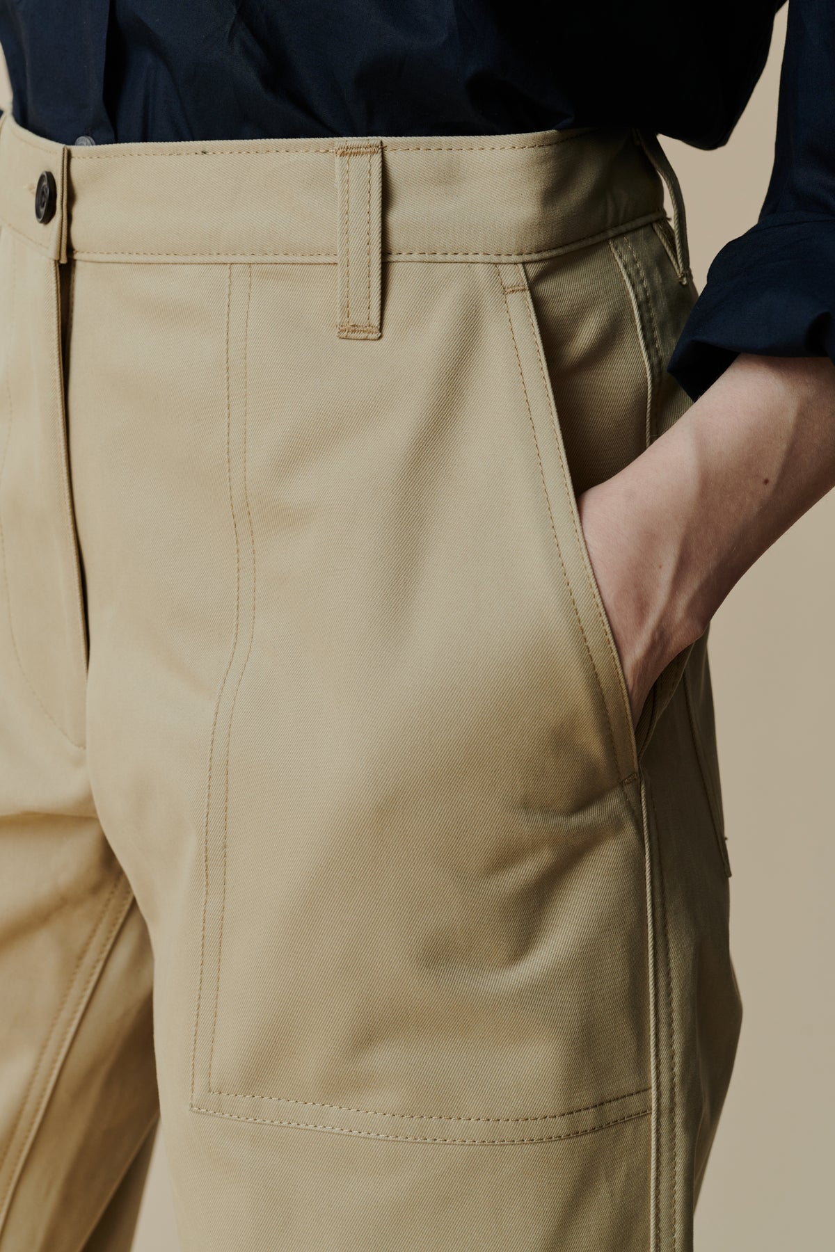 
            front pocket detail of female wearing combat trousers in putty