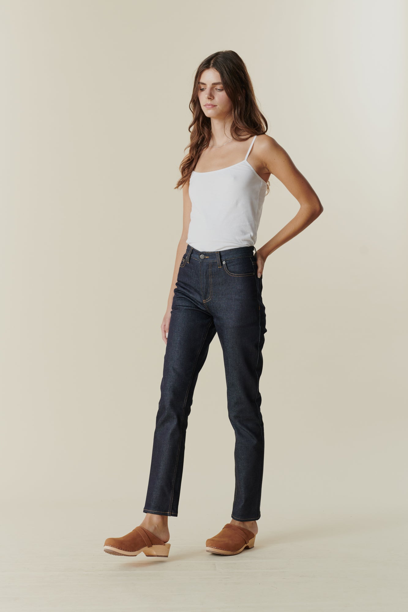 Full body image of straight leg high rise jean in indigo front