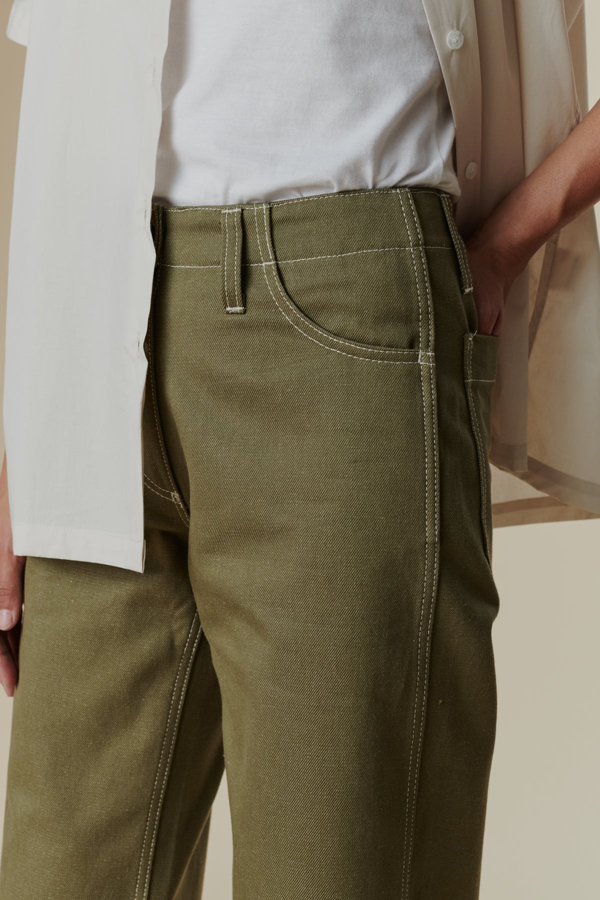 Close-up pocket detail shot of olive work jean