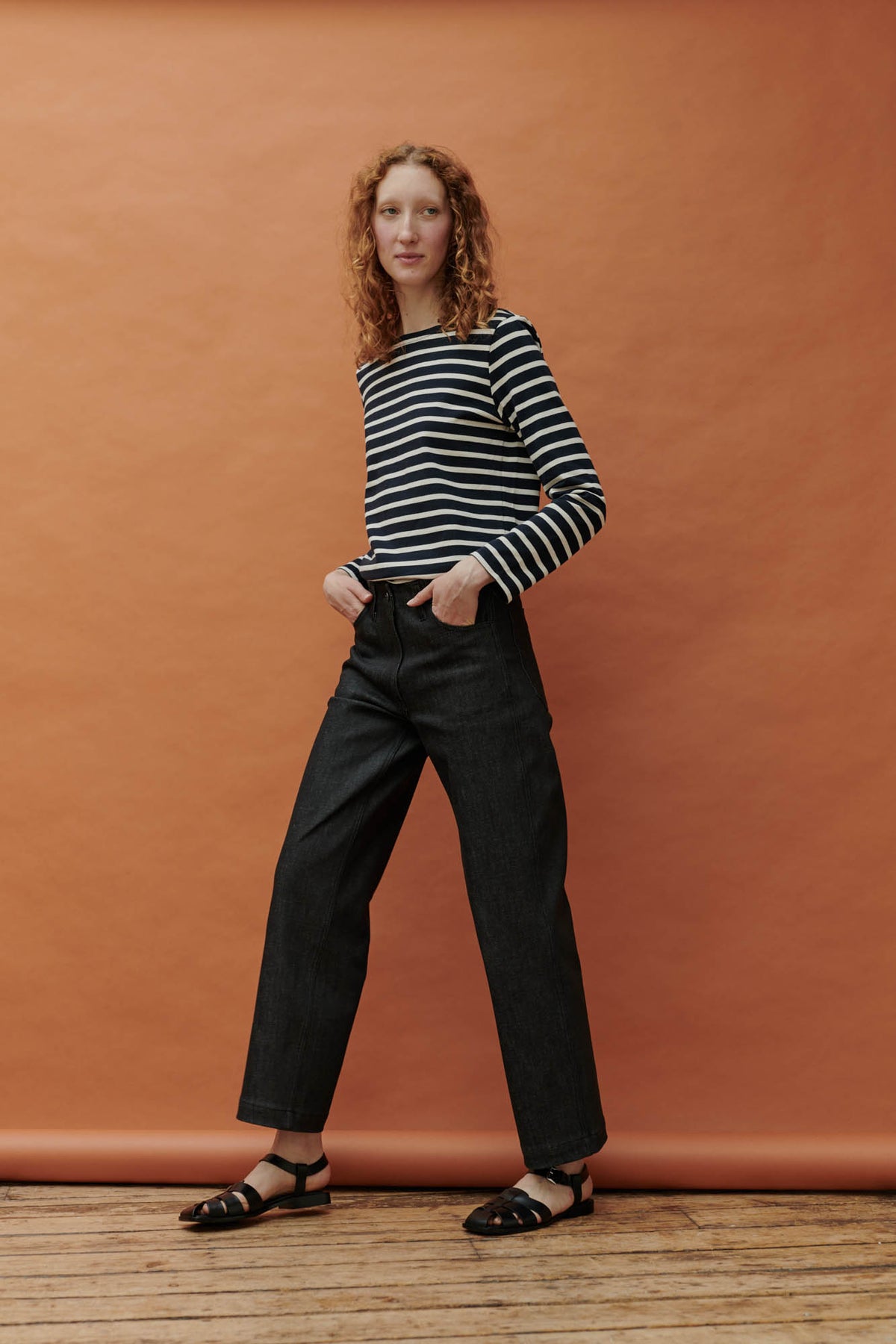 Female wearing work jean in black paired with Breton