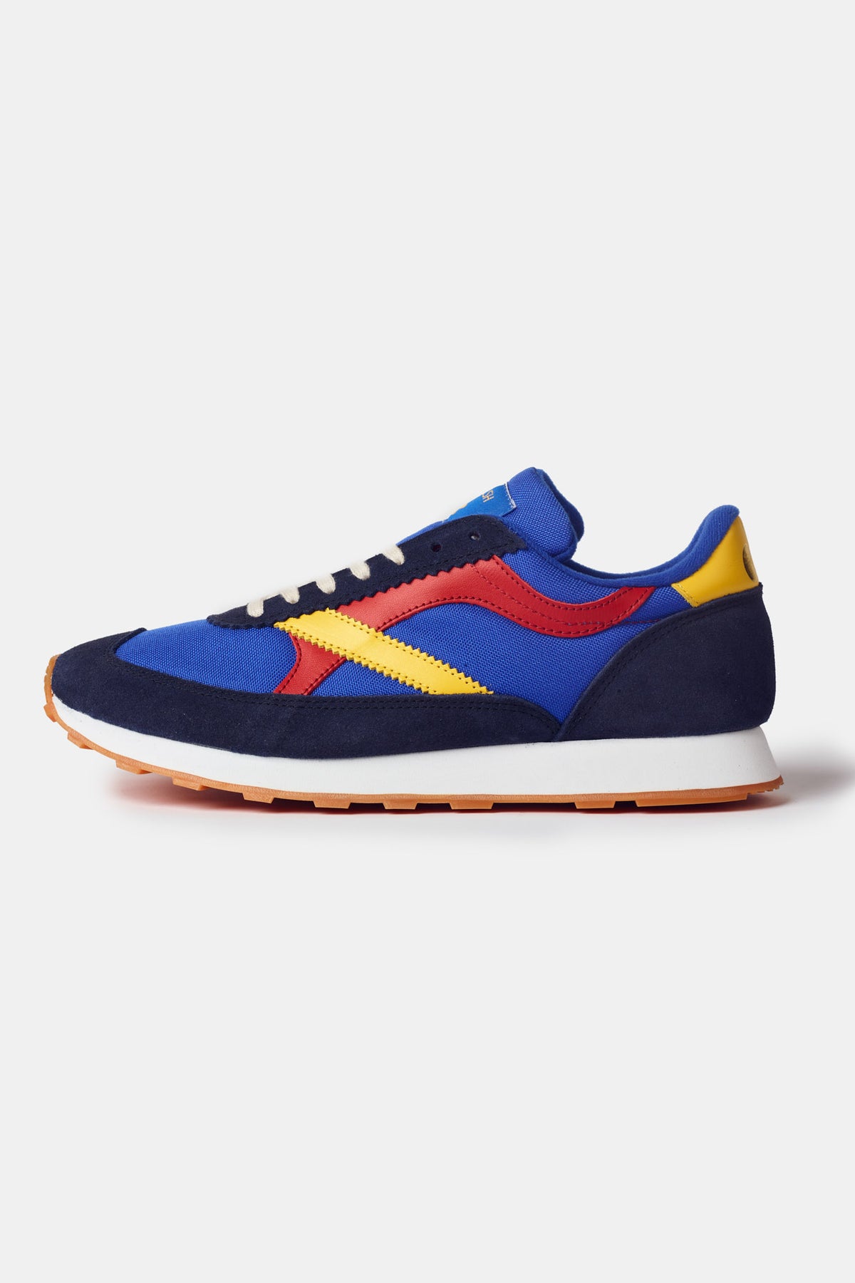 
            Beacon Trainer in blue. White laces with red and yellow side design