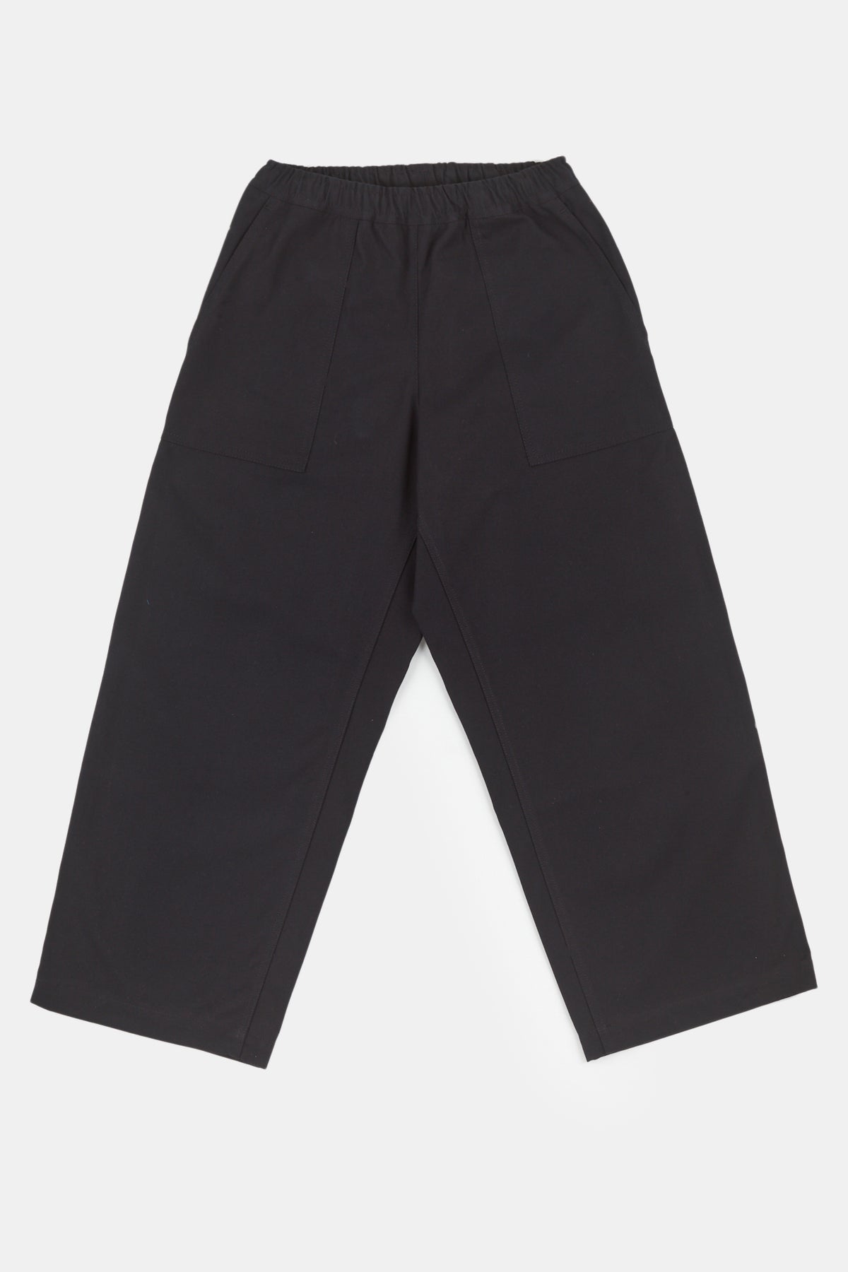 
            Flatlay image of the camerawoman drawstring tapered cotton canvas trousers in black