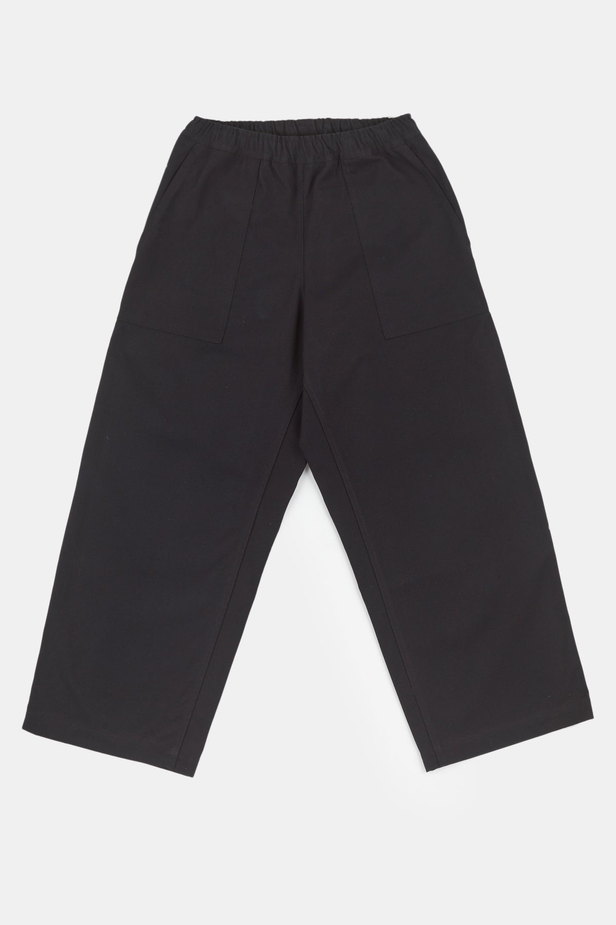 Flatlay image of the camerawoman drawstring tapered cotton canvas trousers in black