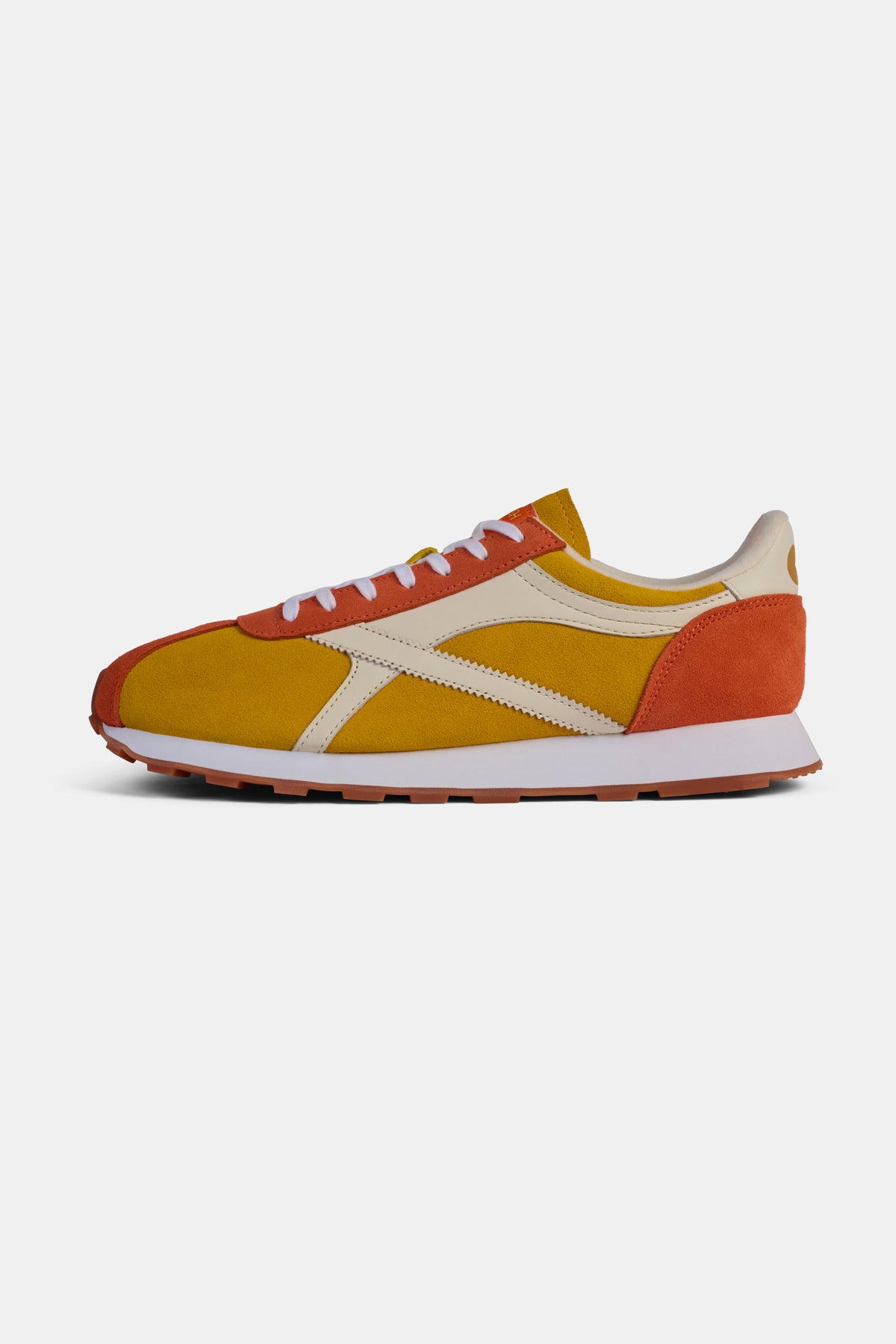 Orange and yellow trainers on a white background.