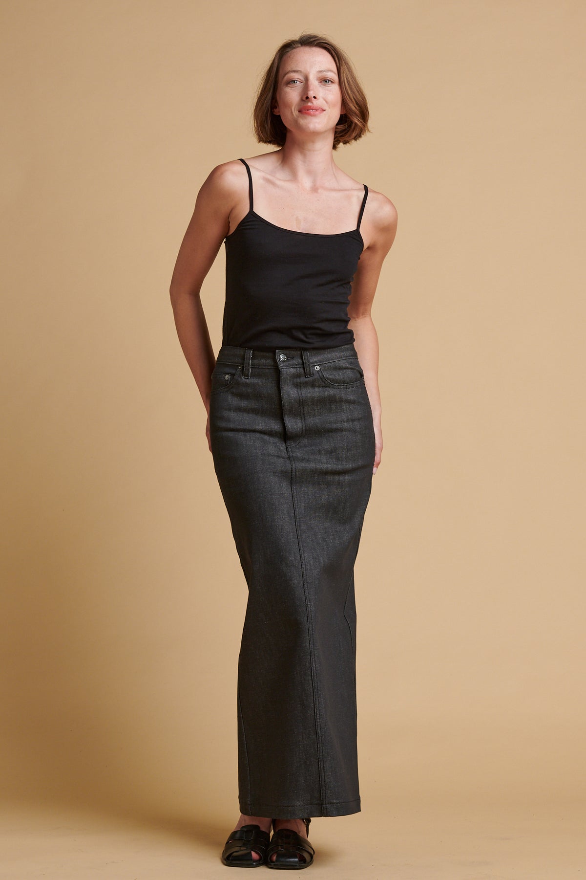Female wearing Frankie denim maxi skirt in black.