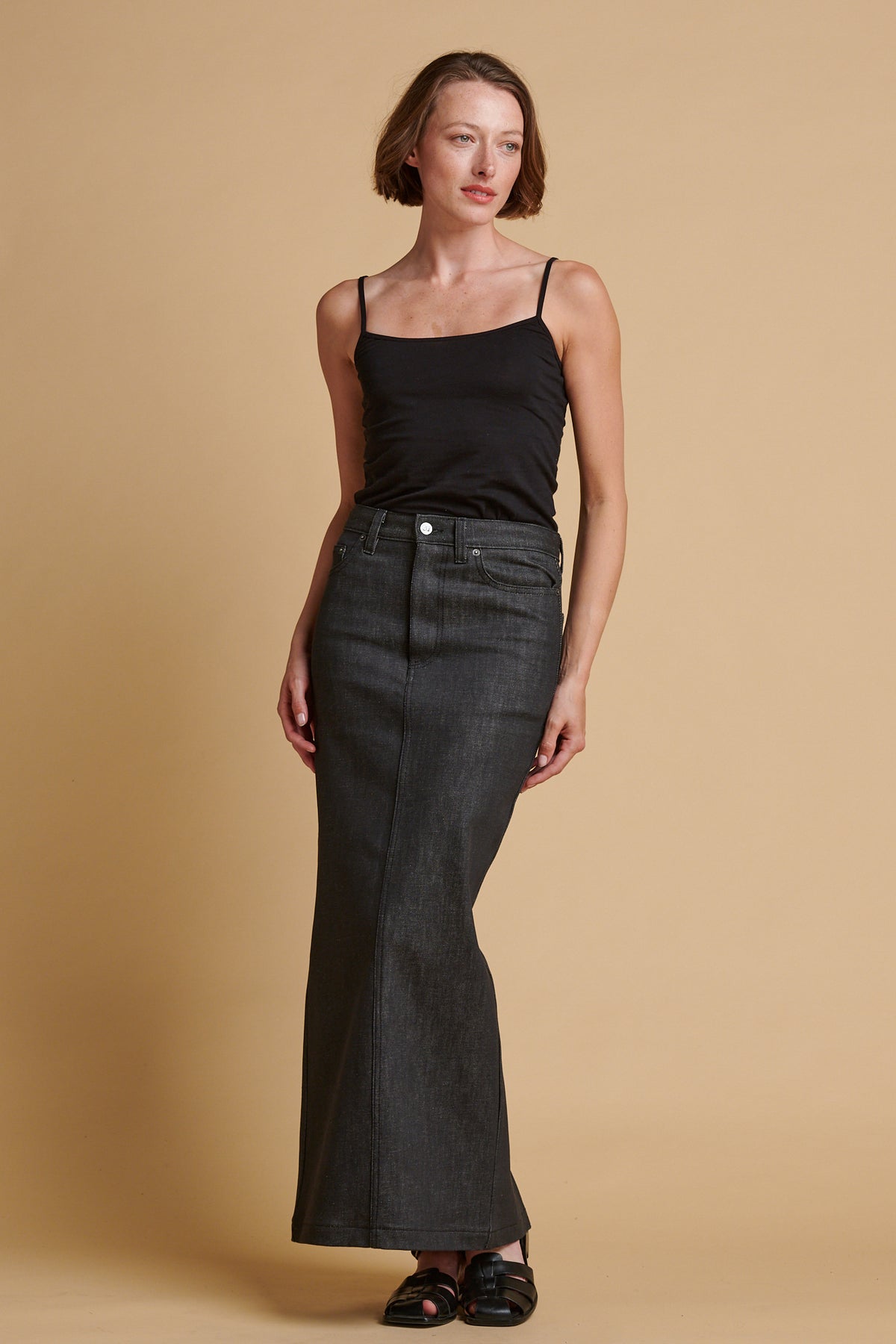Female wearing Frankie denim maxi skirt in black.