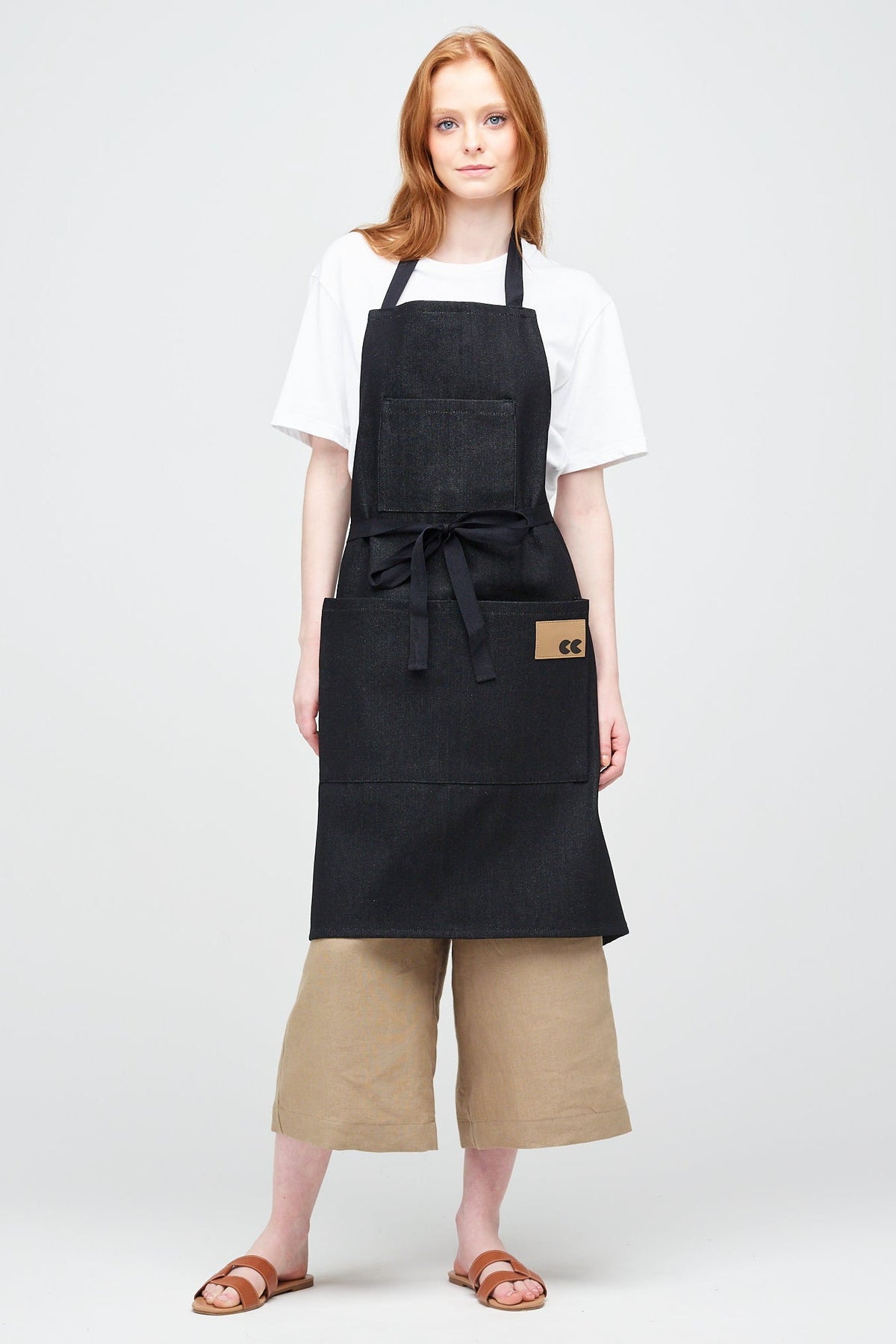White Female with ginger hair wearing Apron in Black Denim