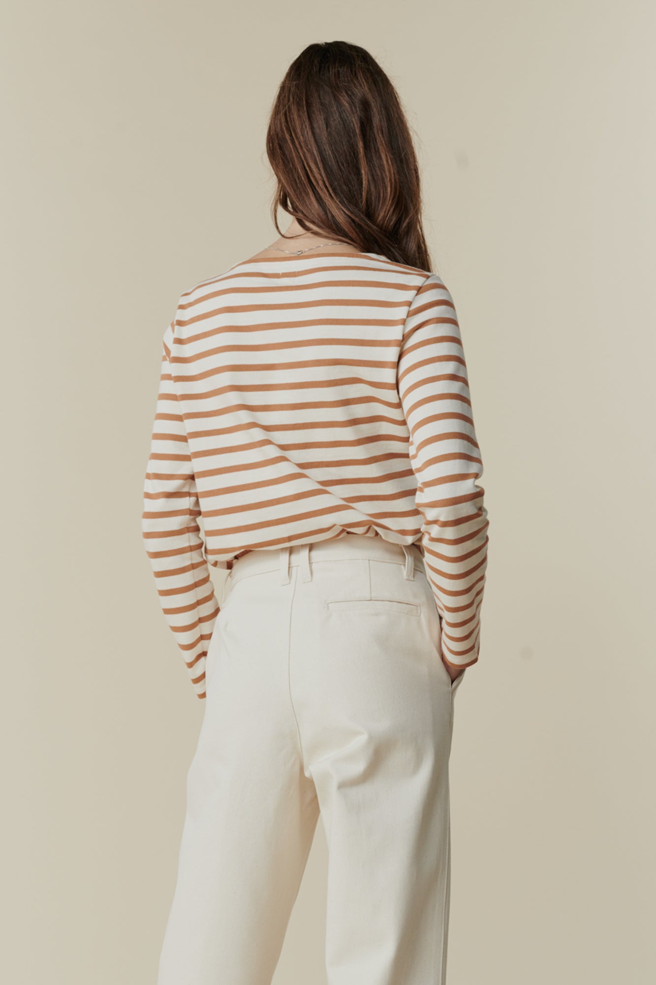 image of back of female wearing breton in ecru cinnamon