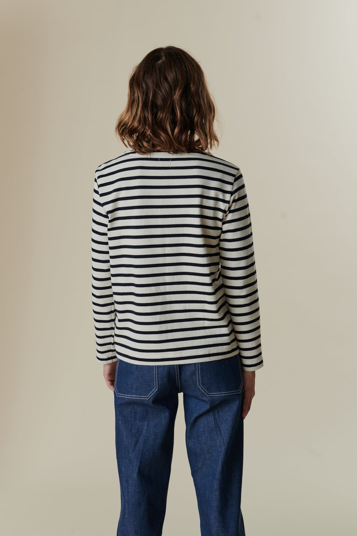 
            Behind of female wearing breton in ecru navy 