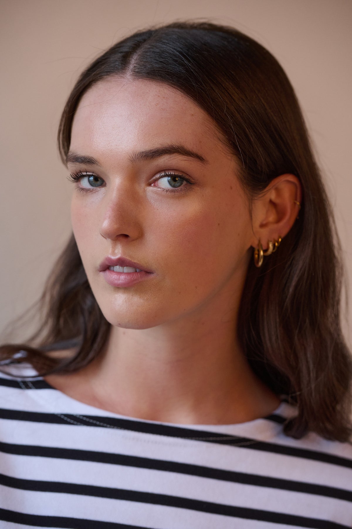 Portrait of female wearing Breton in white and black with boat neck
