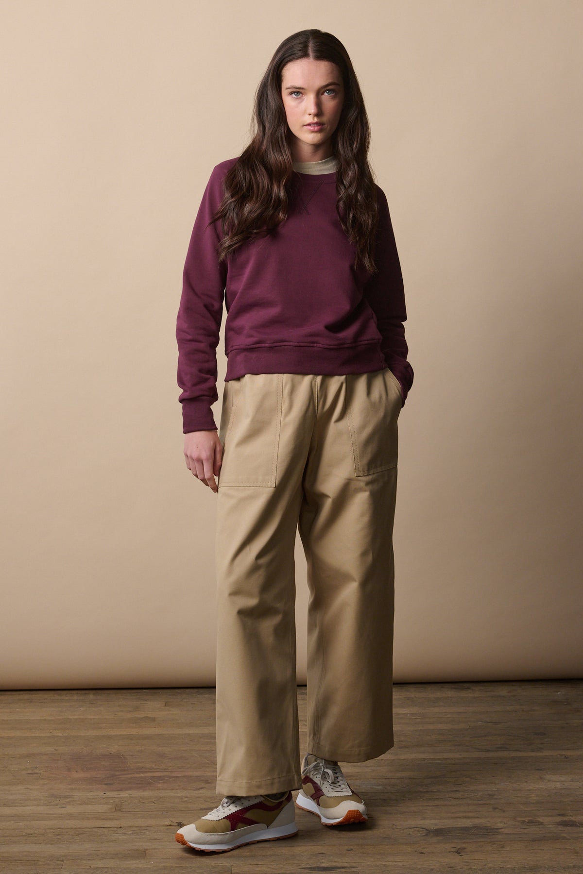 Front of female wearing camerawoman trousers in putty