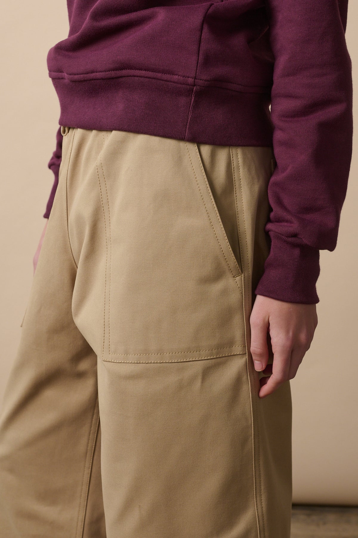 
            Front pocket detail of camerawoman trousers in putty