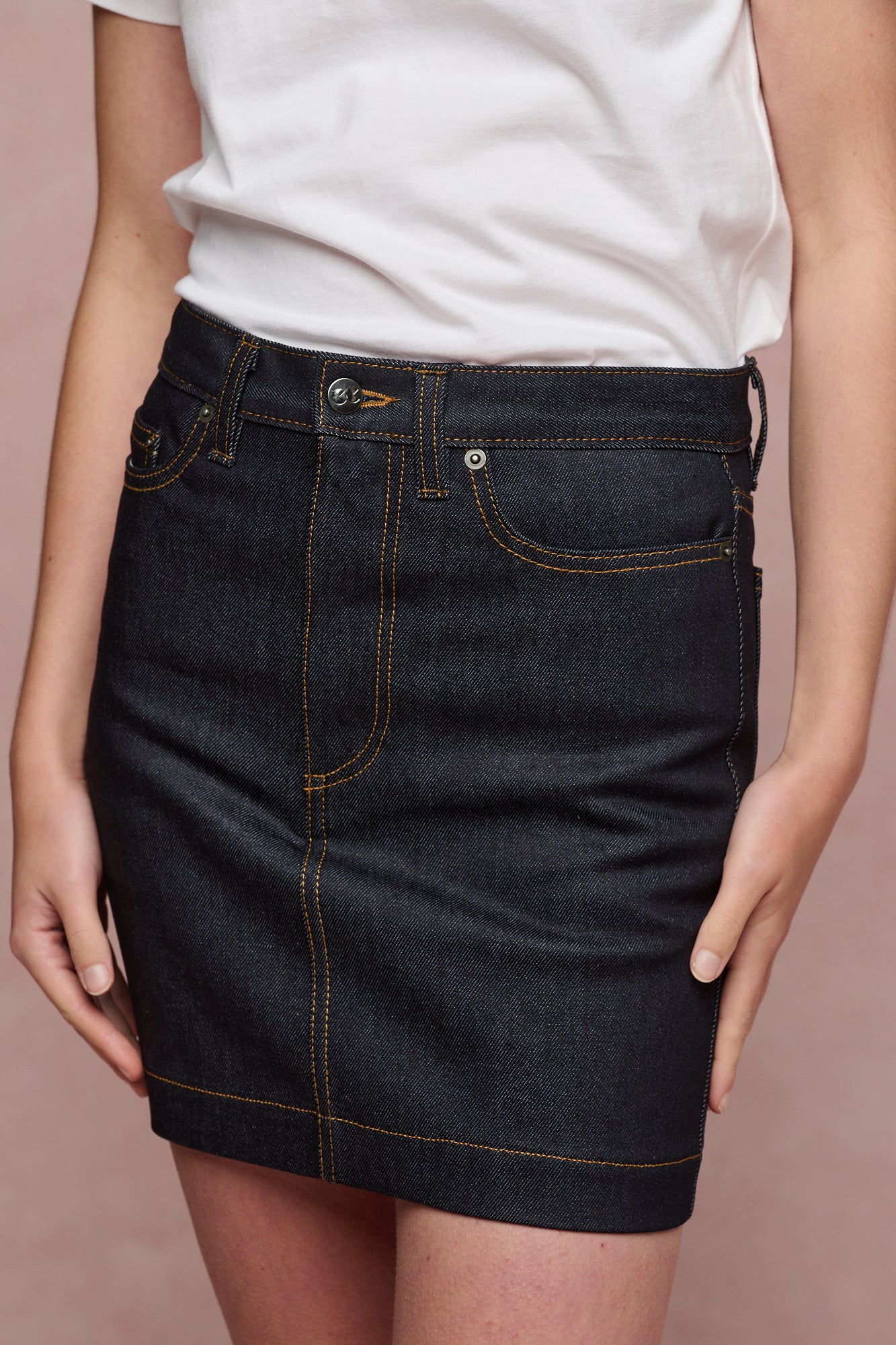 Close up of the front of Charlie denim mini skirt in indigo