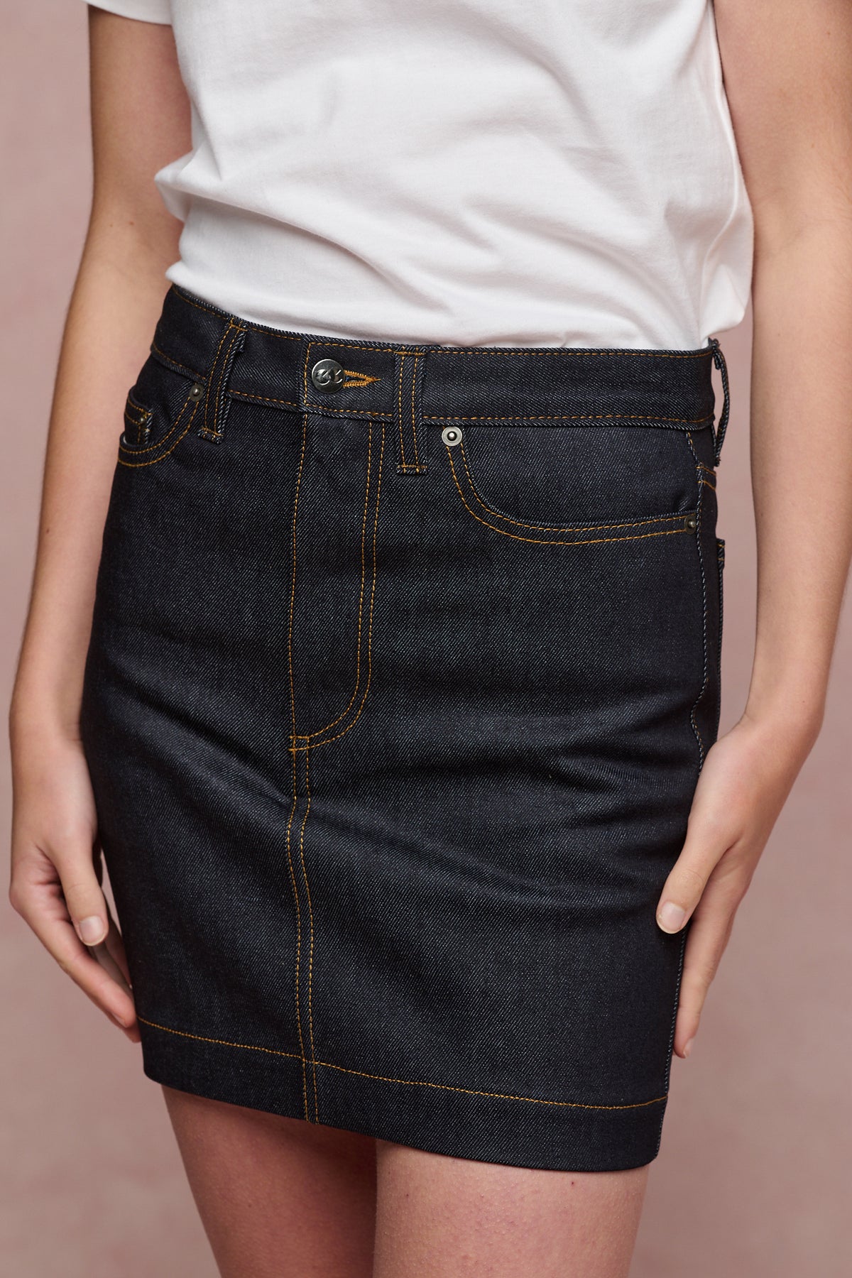 Close up of the front of Charlie denim mini skirt in indigo