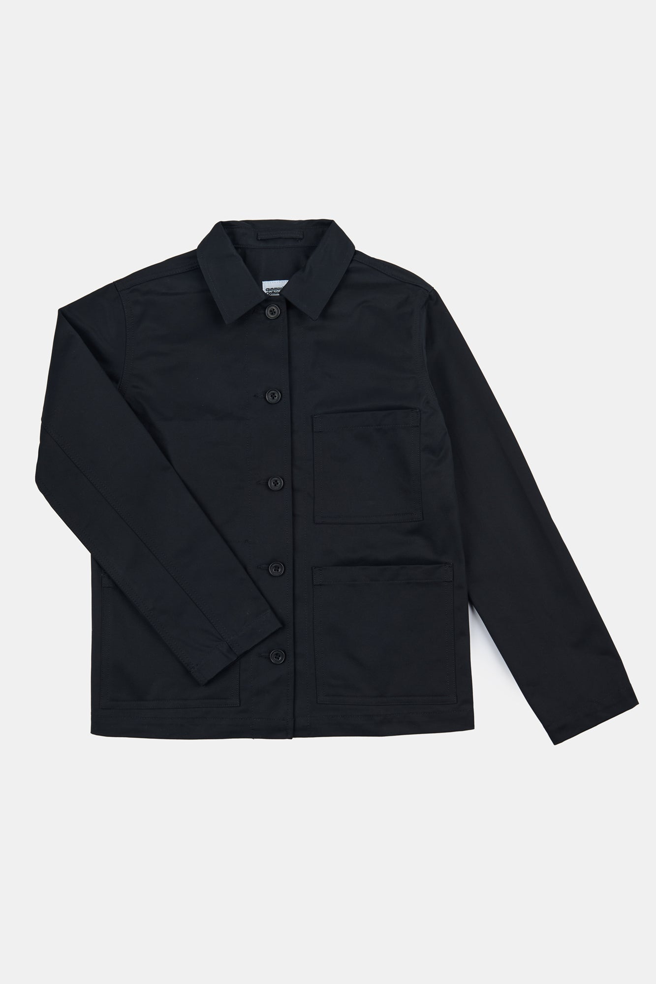 Women's Chore jacket in black flatlay shot. 5 button front with three external pockets and one internal chest pocket.