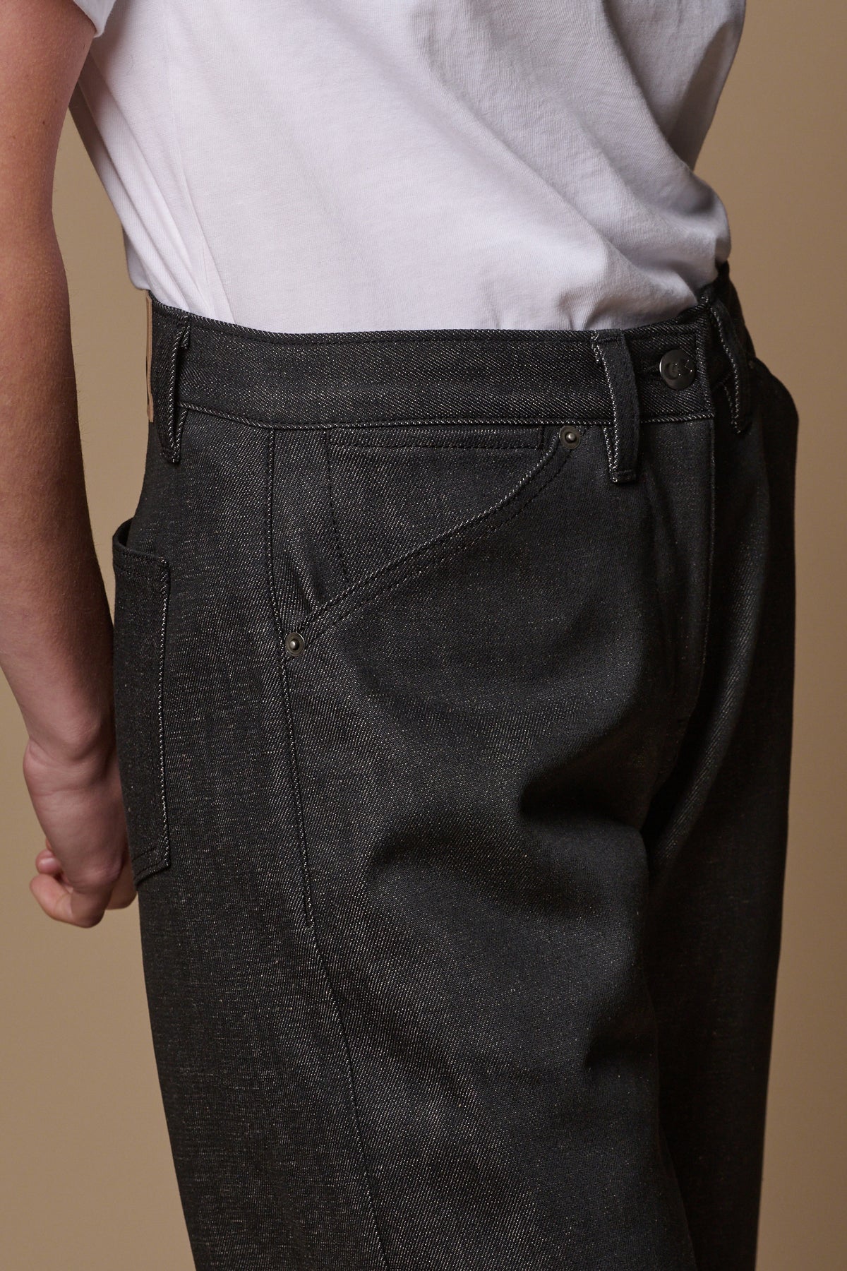 Front waistband detail image showing belt loops and front pockets