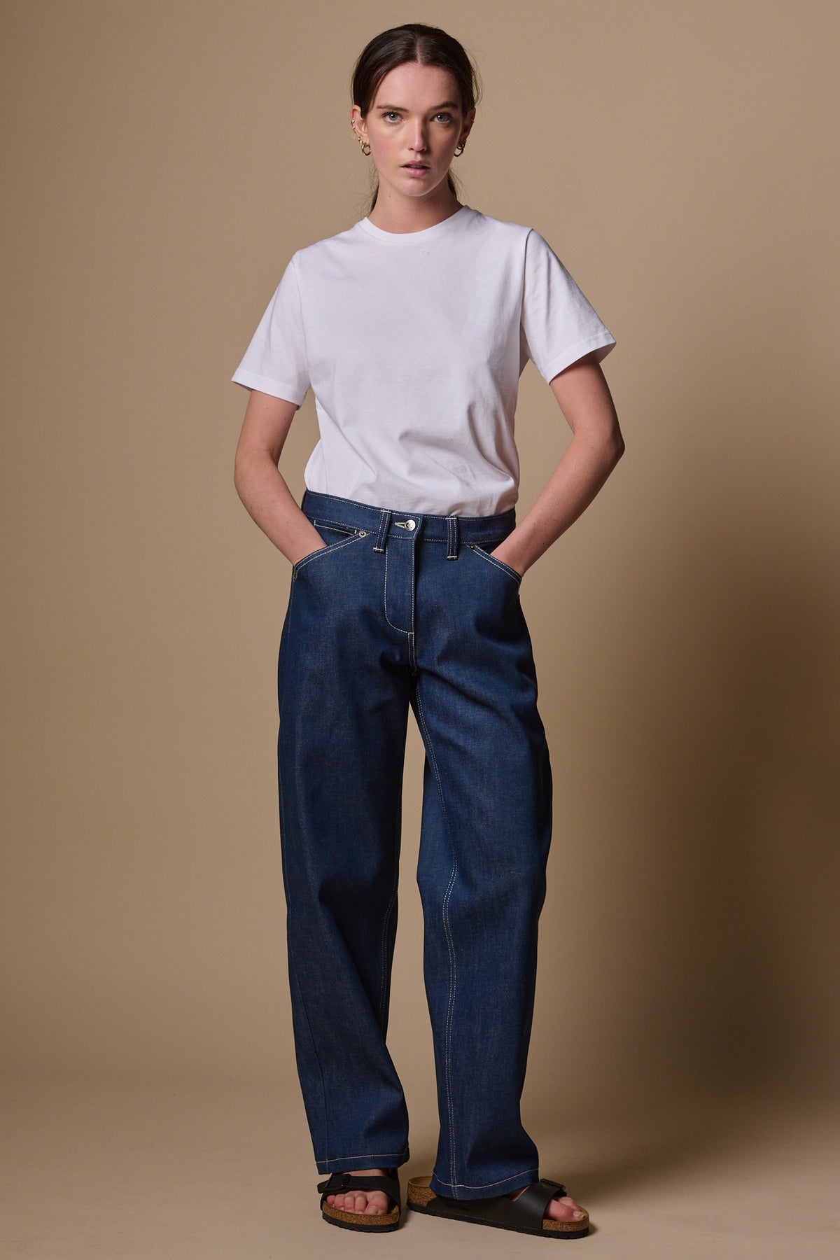 
            Female with hands in front pockets of the chore wide tapered jeans in blue 
