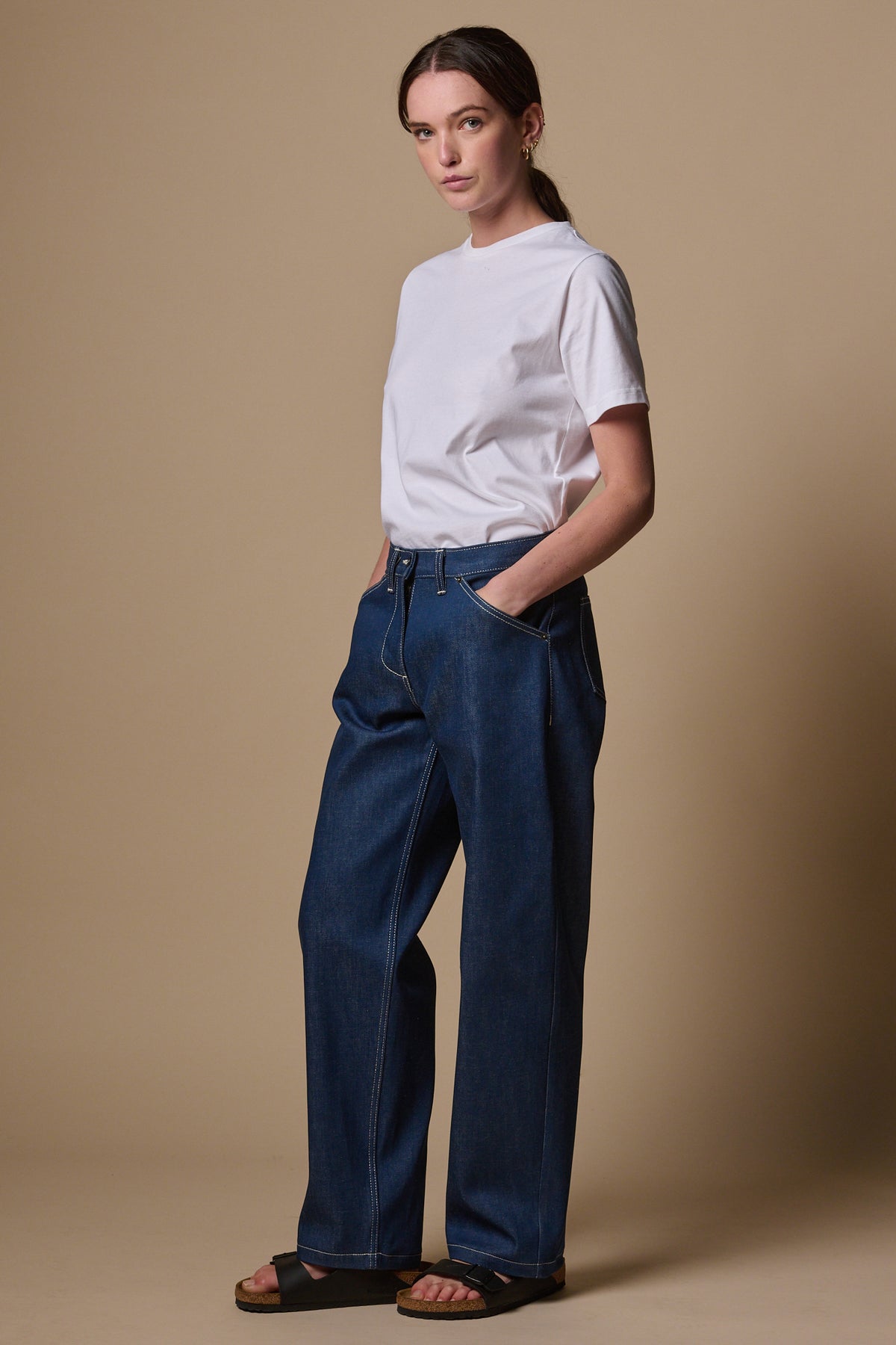 
            Female with hands in front pockets of the chore wide tapered jeans in blue 
