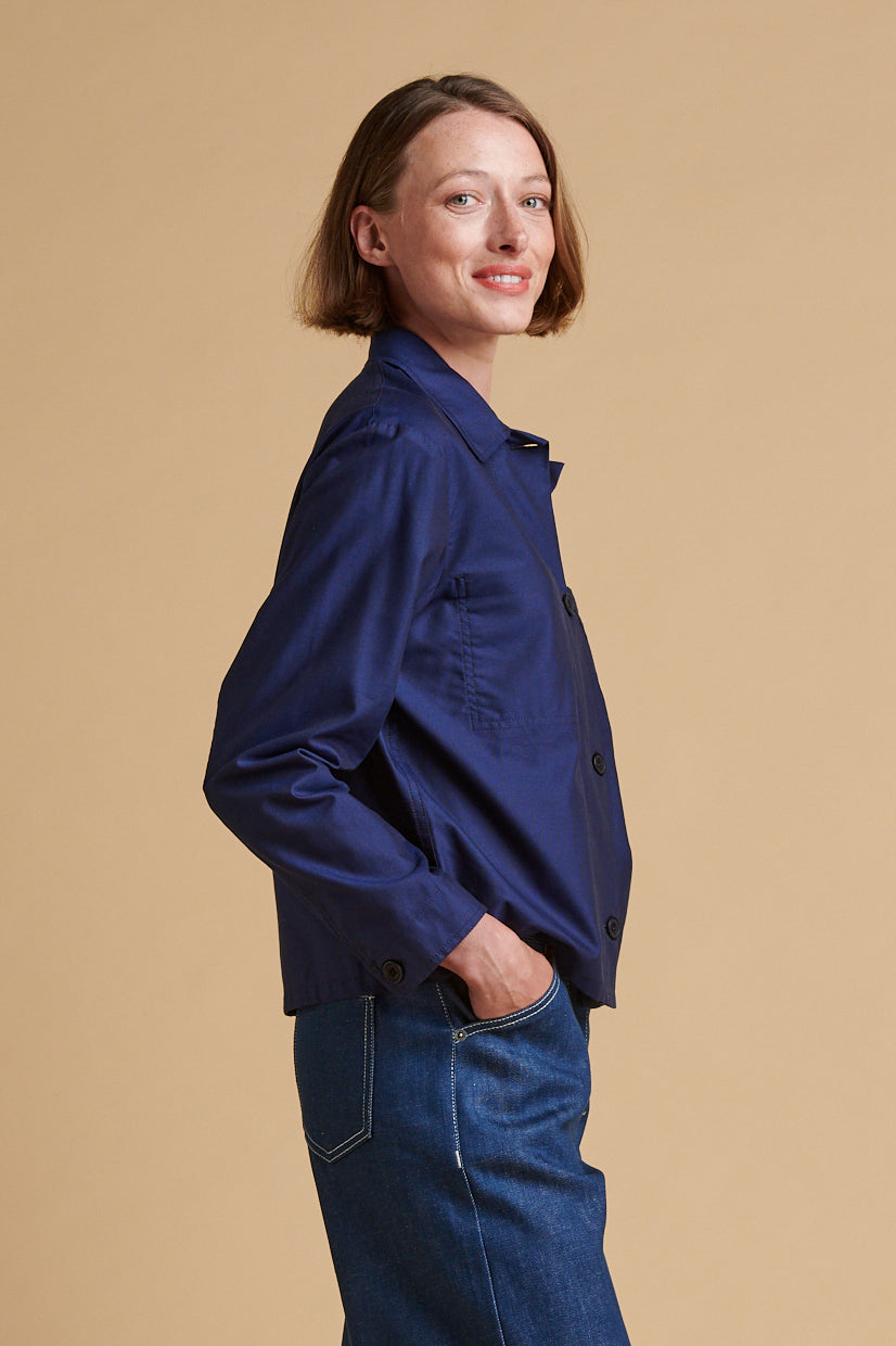 The side of thigh up front of female wearing Elena shirt in navy.