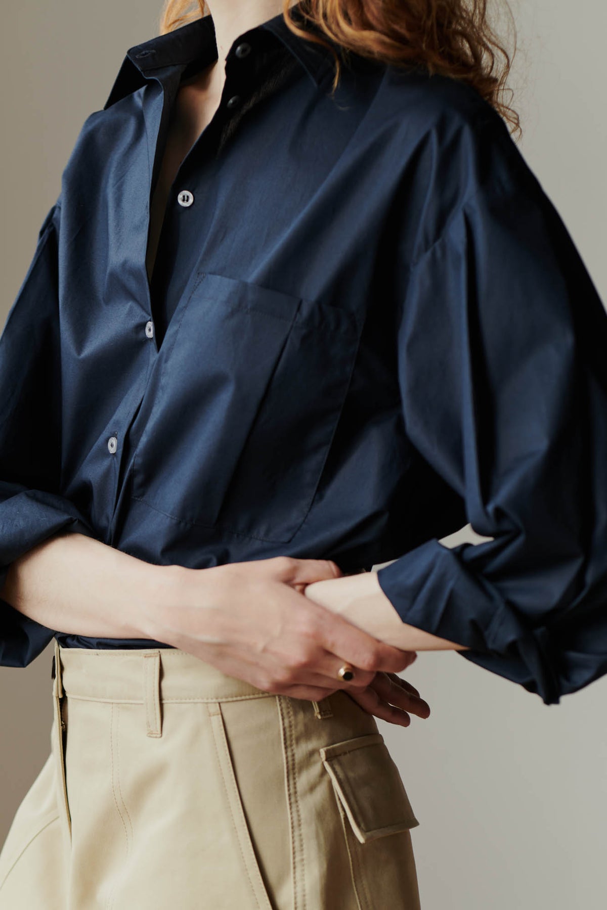 
            close up side angle detail shot of the esme long sleeve shirt in navy