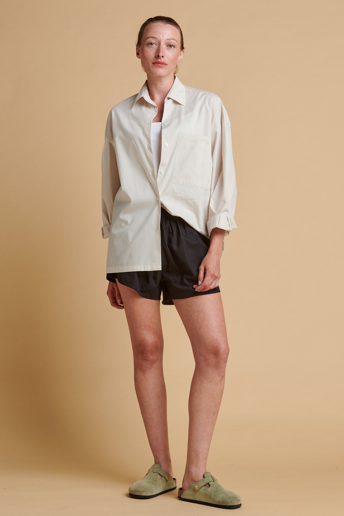 Female wearing long sleeve Esme shirt in stone.