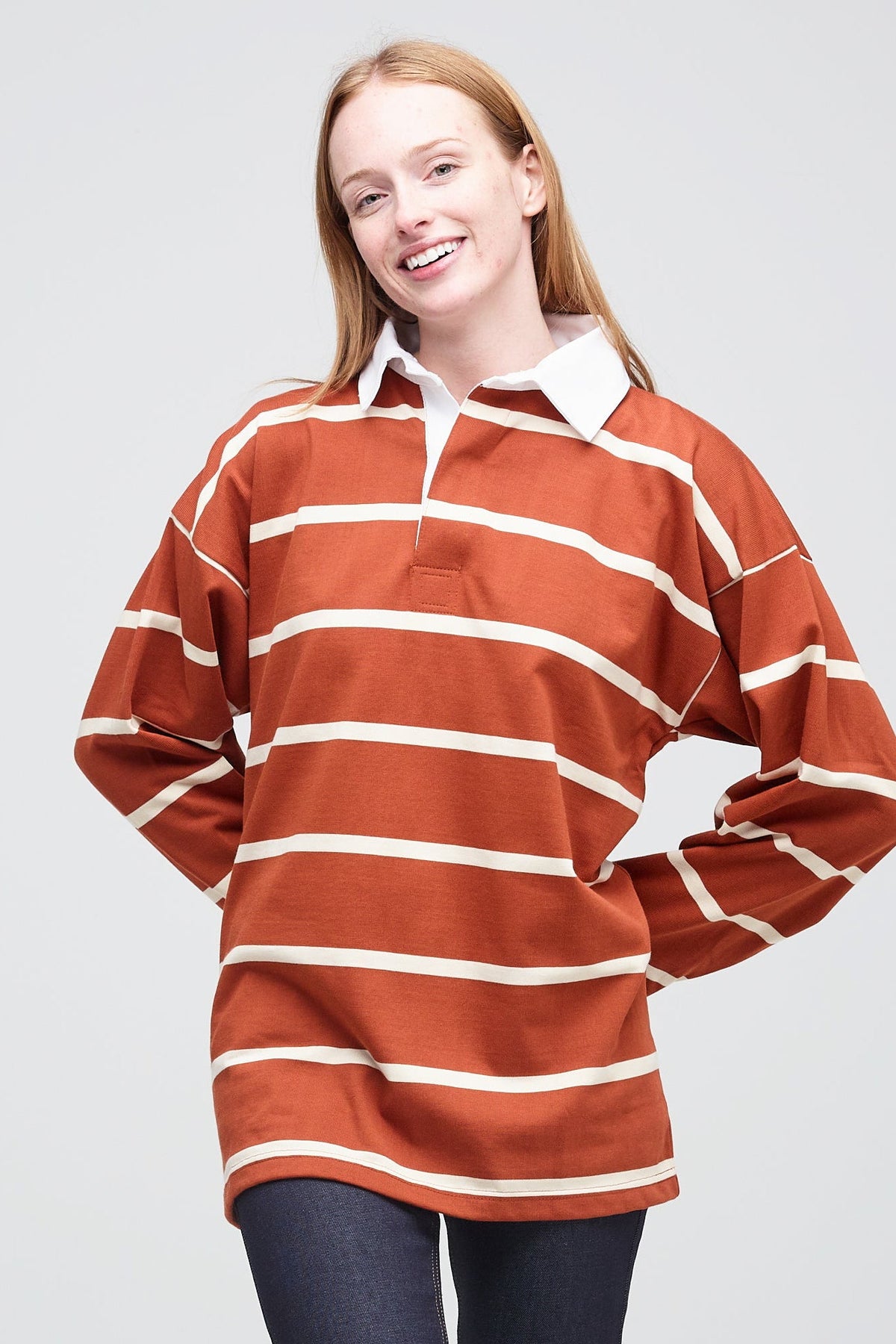Thigh up image of female wearing Fine Stripe Rugby Shirt Cinnnamon Ecru