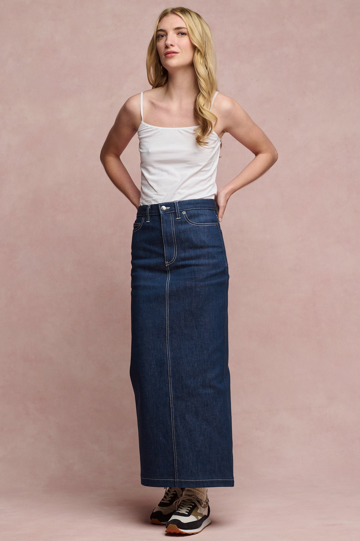 Full body image of the front blonde female wearing Frankie denim maxi skirt in blue