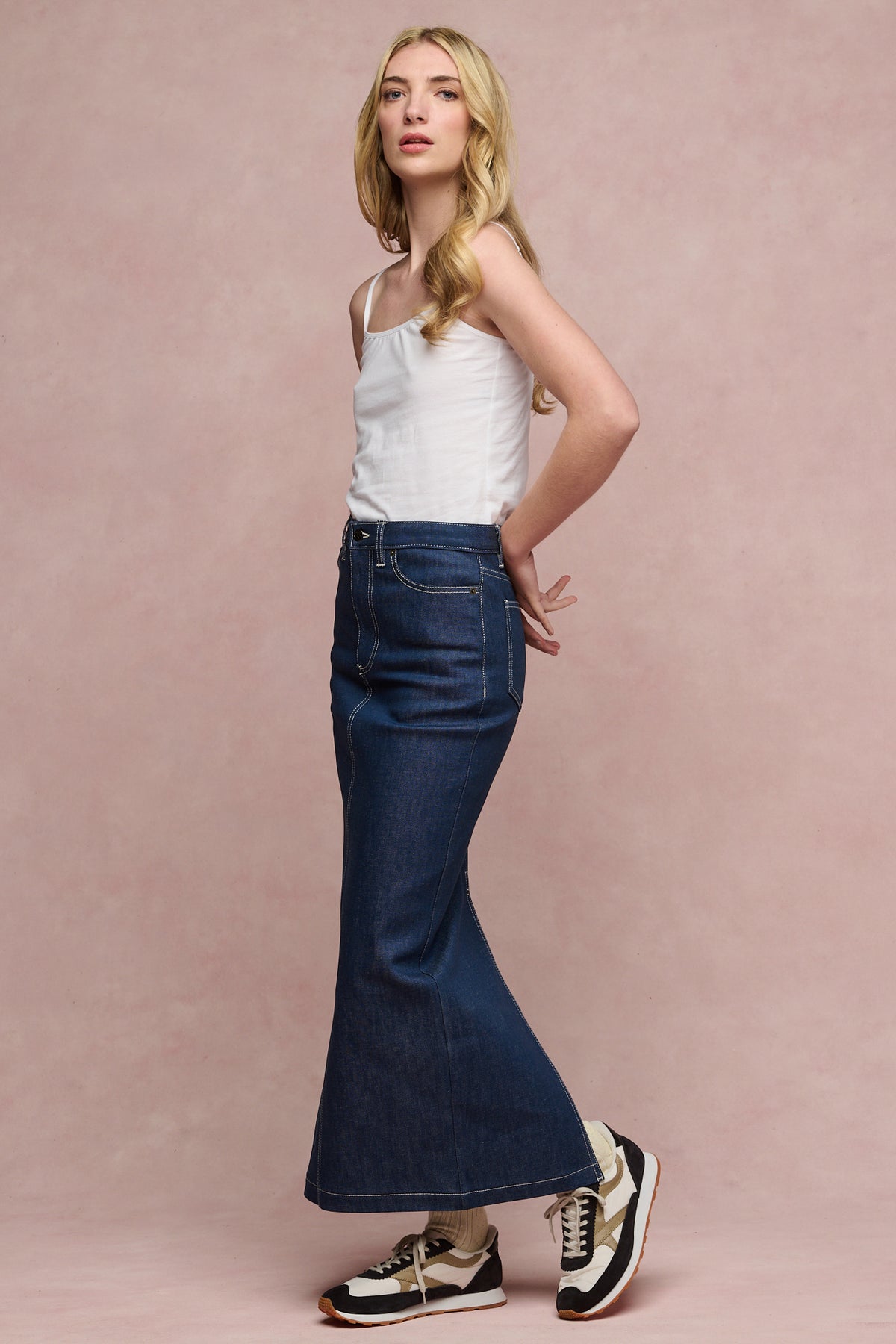 The side of blonde female wearing Frankie denim maxi skirt in blue