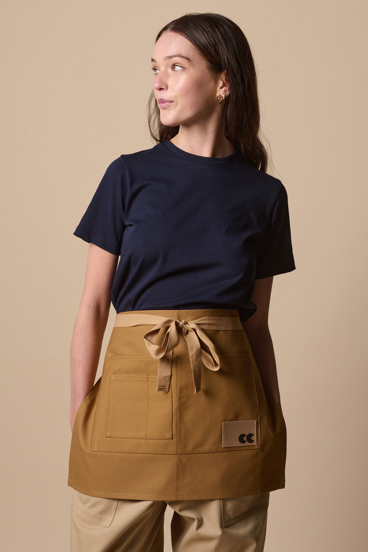 female wearing unisex garden apron in khaki