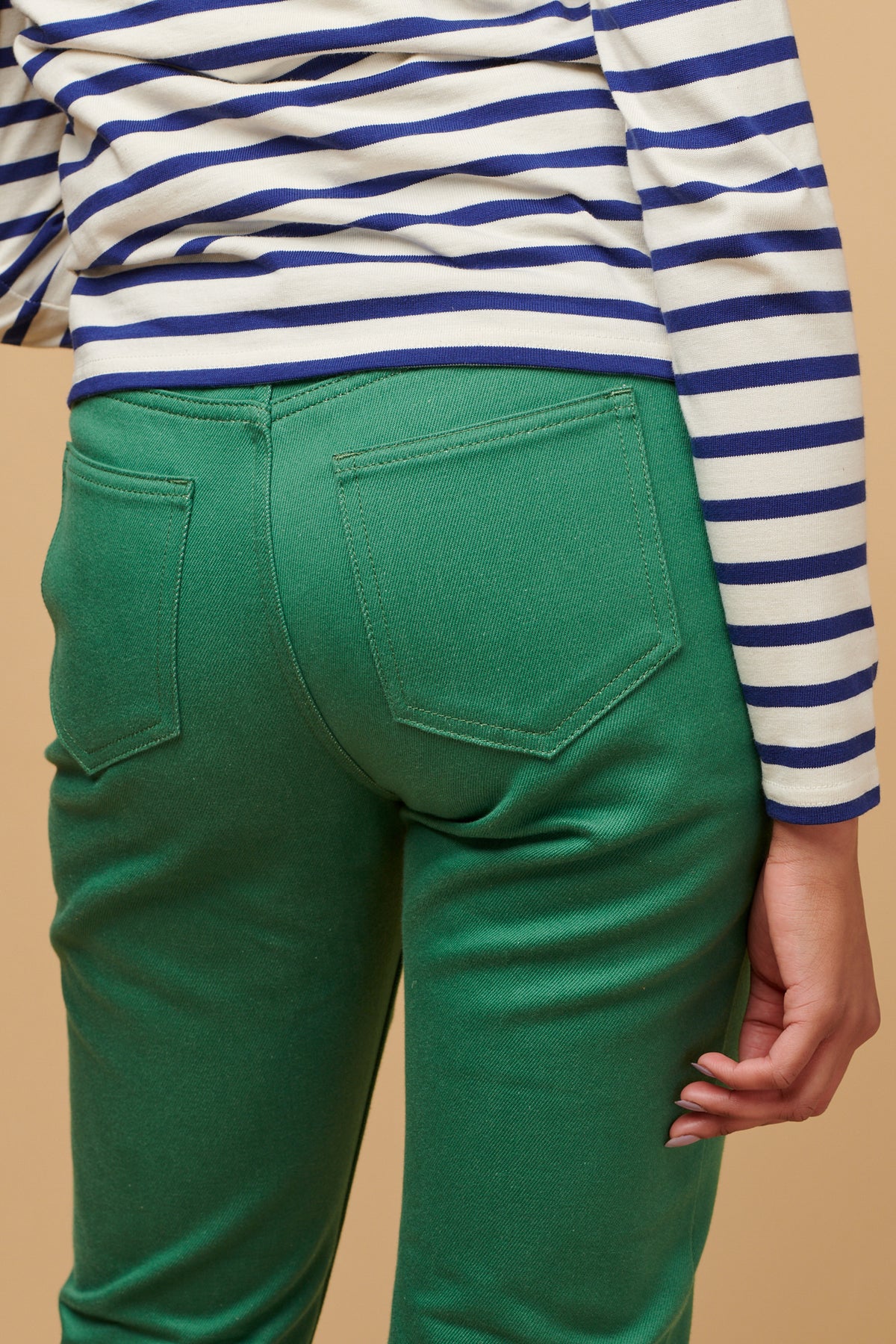 The back of green Gloria jean with two back pockets