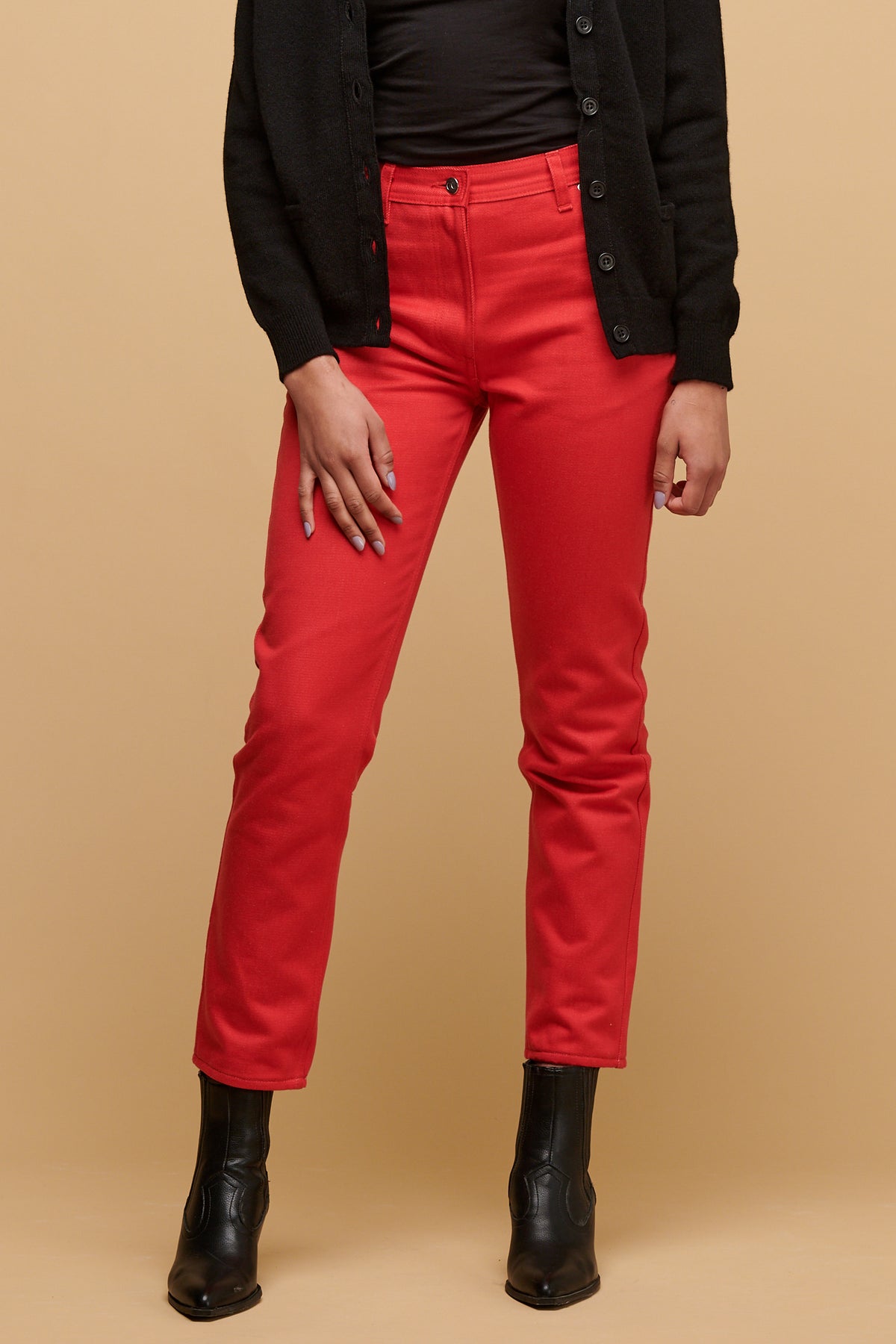 Chest down of female wearing Gloria jean in poppy paired with black boot