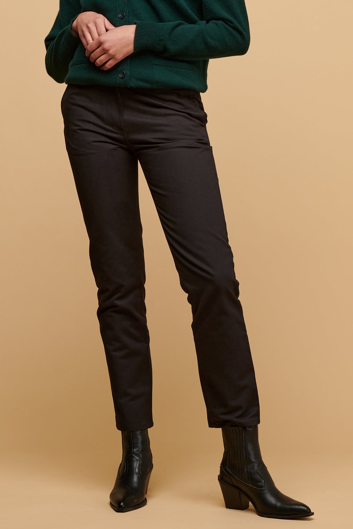 Chest down of female wearing heavyweight slim chino in black