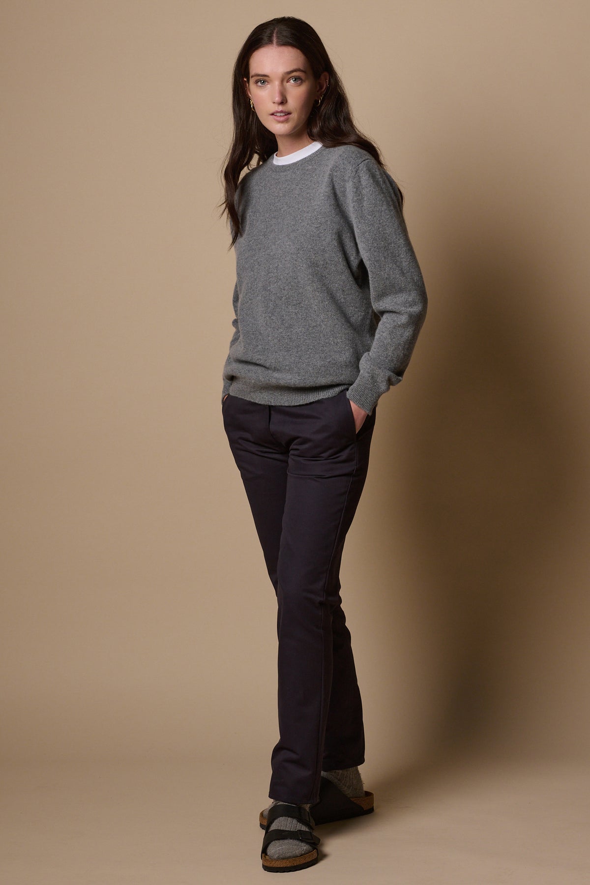 Brunette female wearing heavyweight slim chino in navy