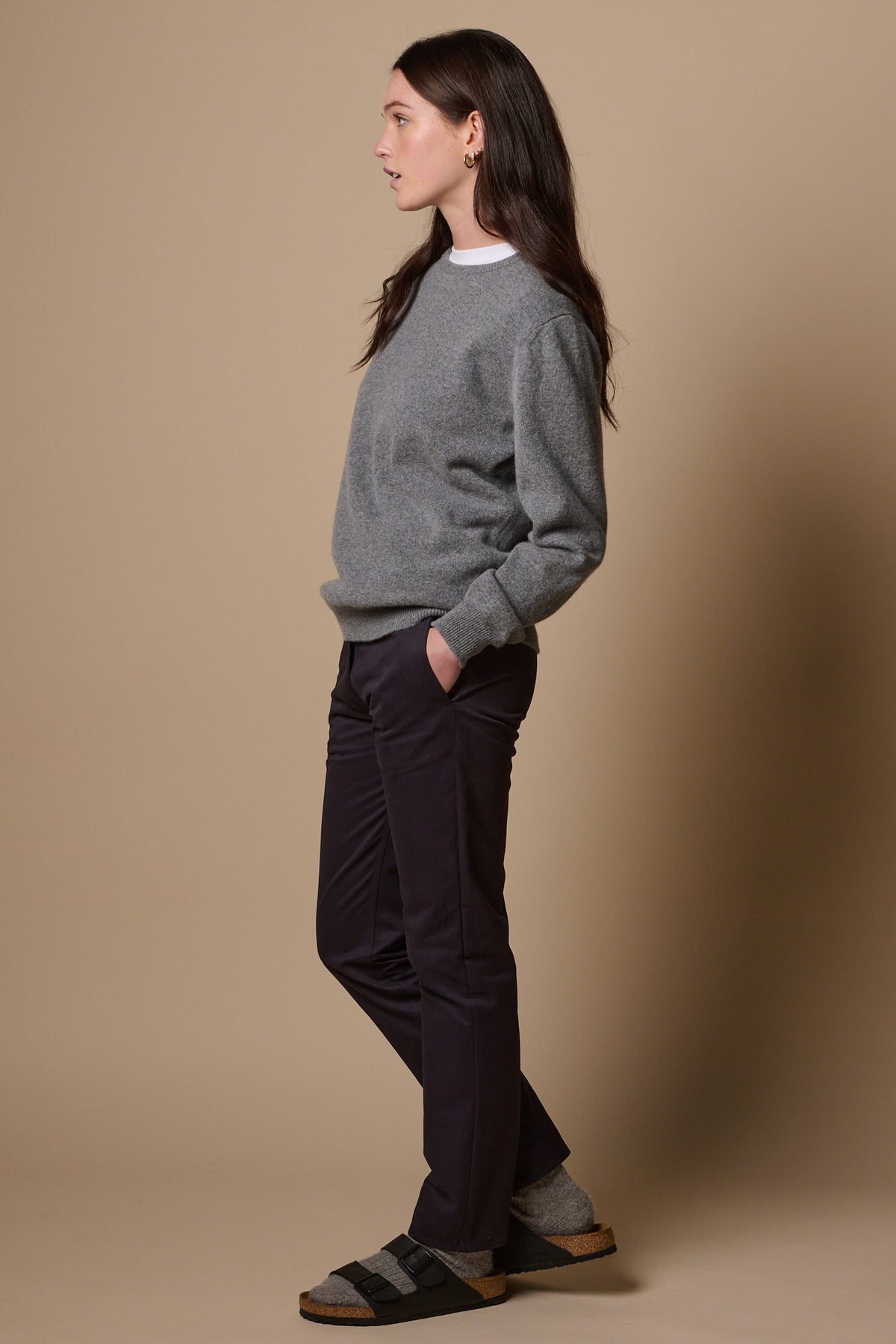 side view of female wearing heavyweight slim chino in navy
