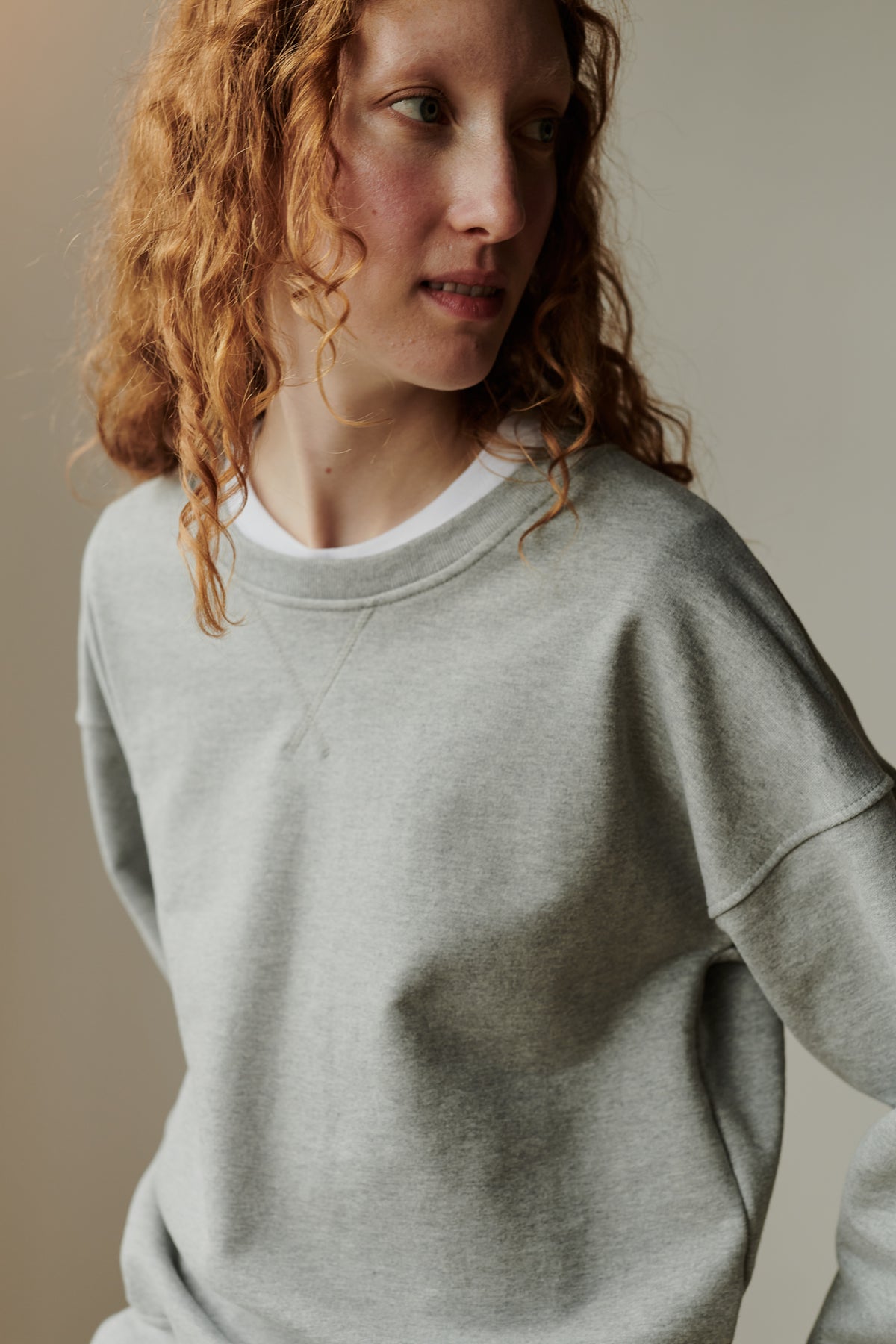 Female wearing heritage sweatshirt in grey
