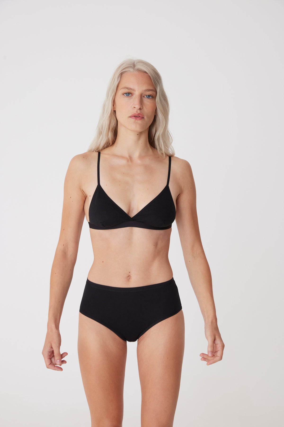 
            blonde female wearing high rise brief in black